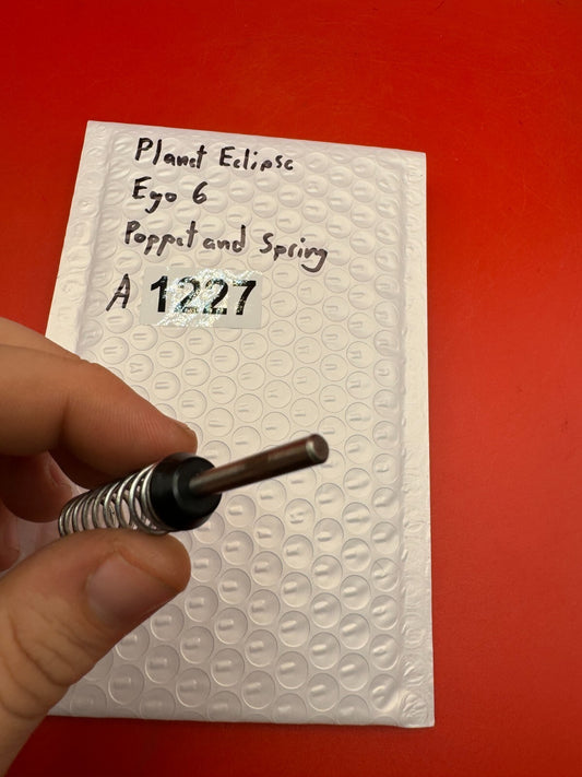 Planet Eclipse Ego 6 Poppet and Spring - used paintball poppet valve and spring - black/silver