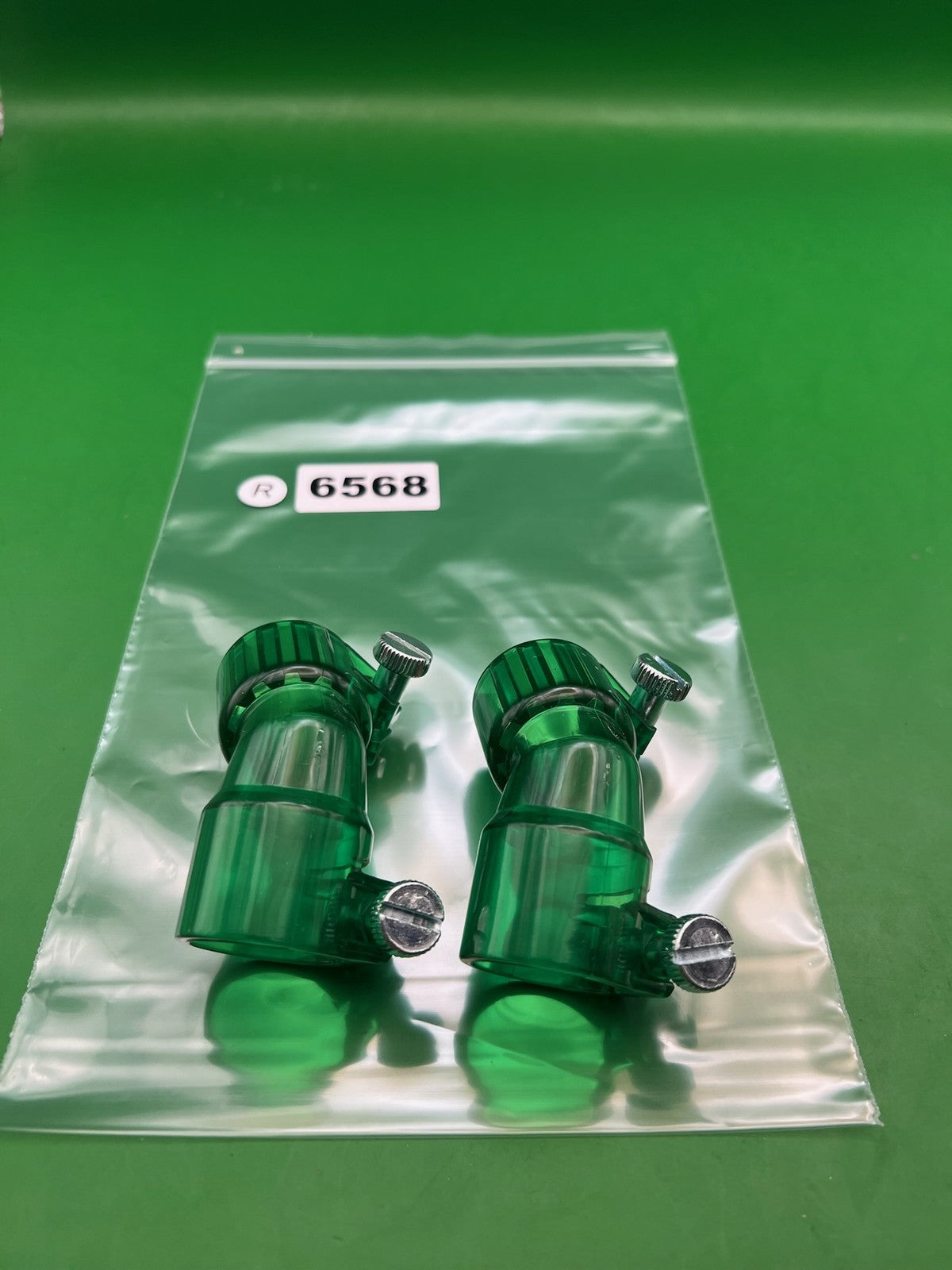 Pair of 2 Green Paintball Right Feed Elbows - used paintball feed elbow - transparent green