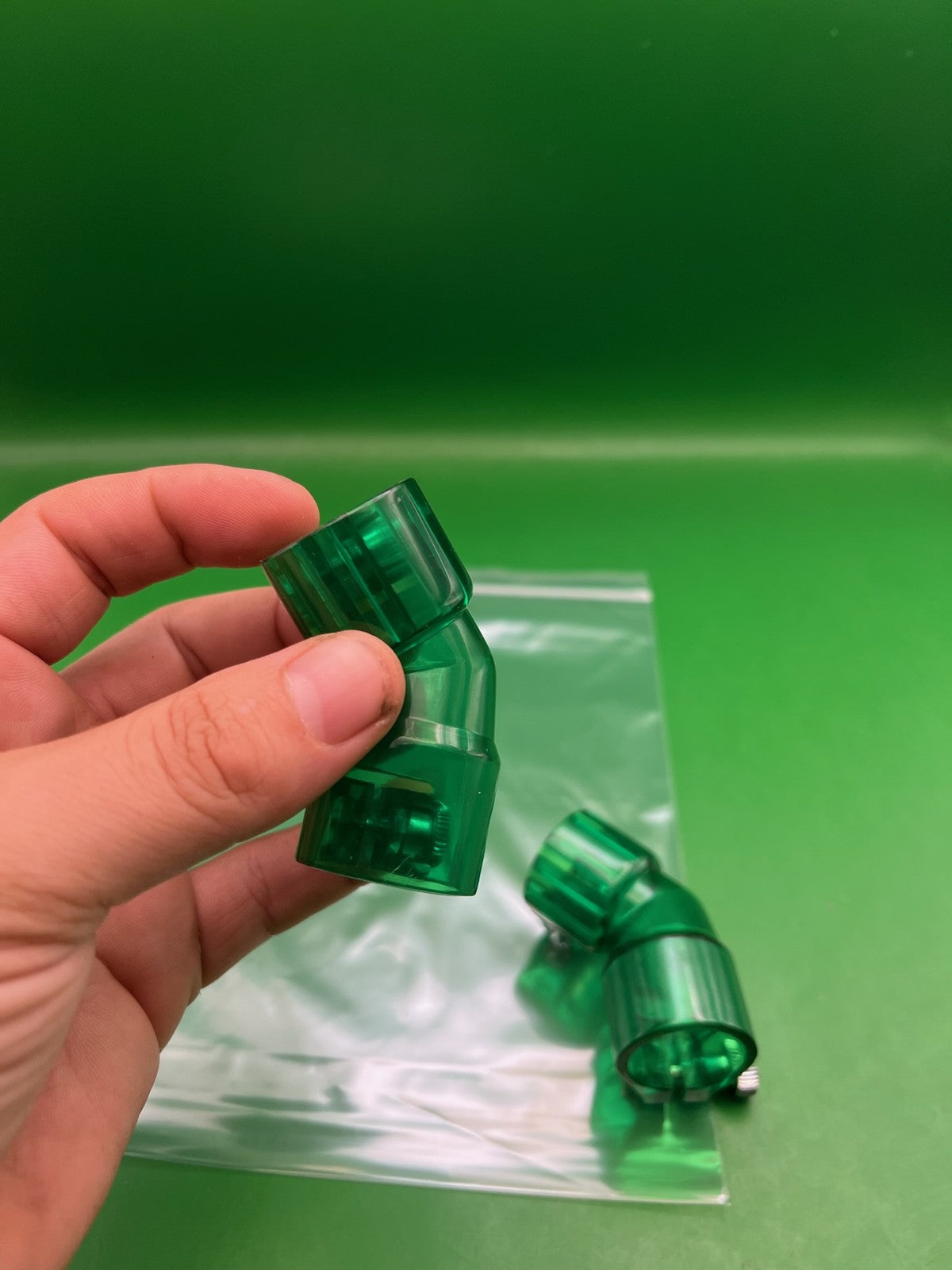 Pair of 2 Green Paintball Right Feed Elbows - used paintball feed elbow - transparent green
