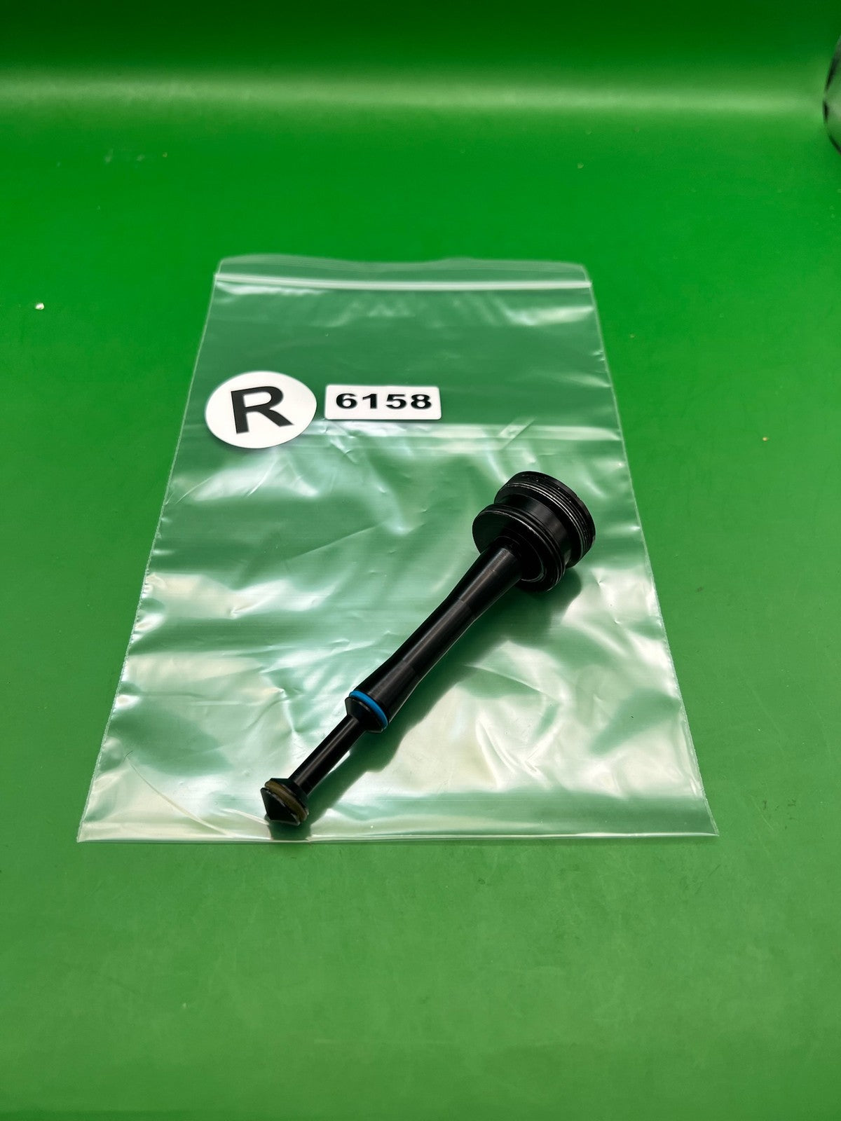 Stock NXT Bolt Guide - used paintball bolt guide - black