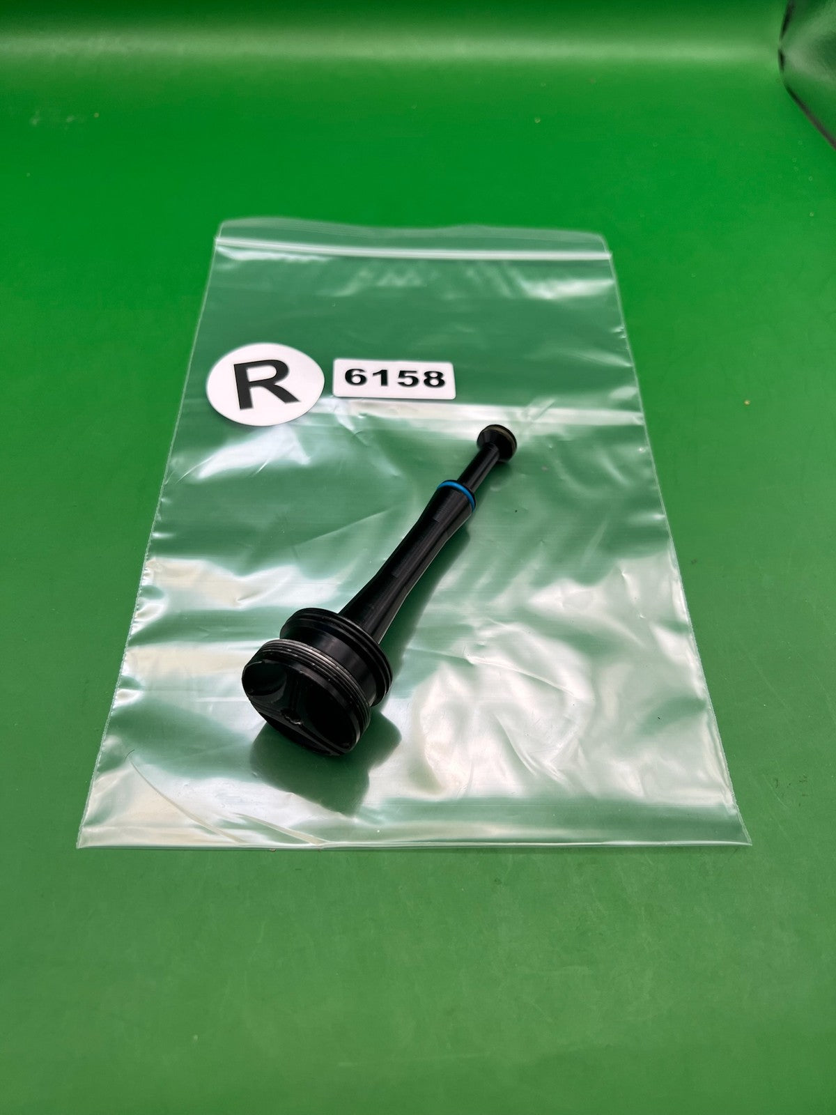 Stock NXT Bolt Guide - used paintball bolt guide - black