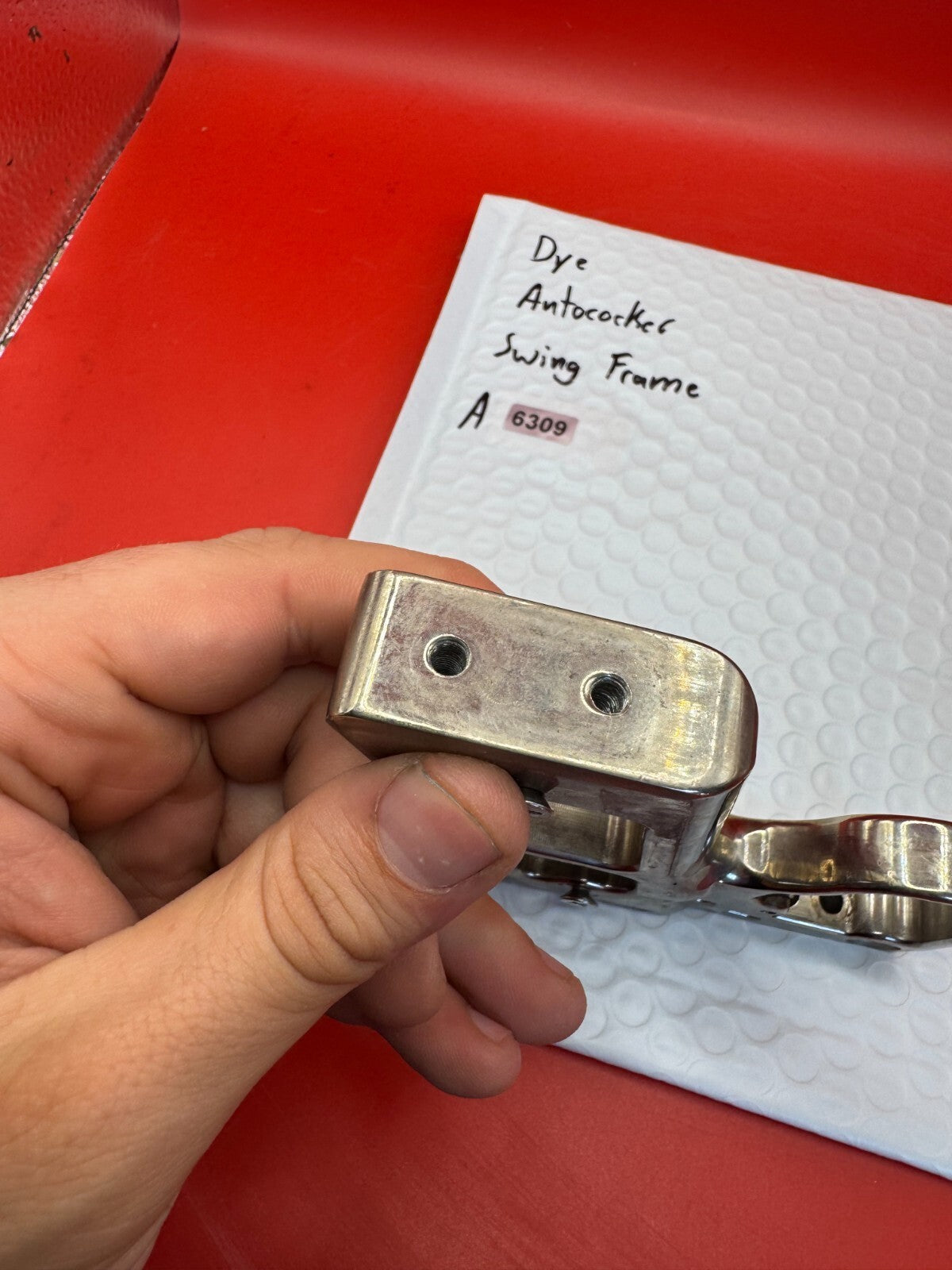 Dye Autococker Swing Frame