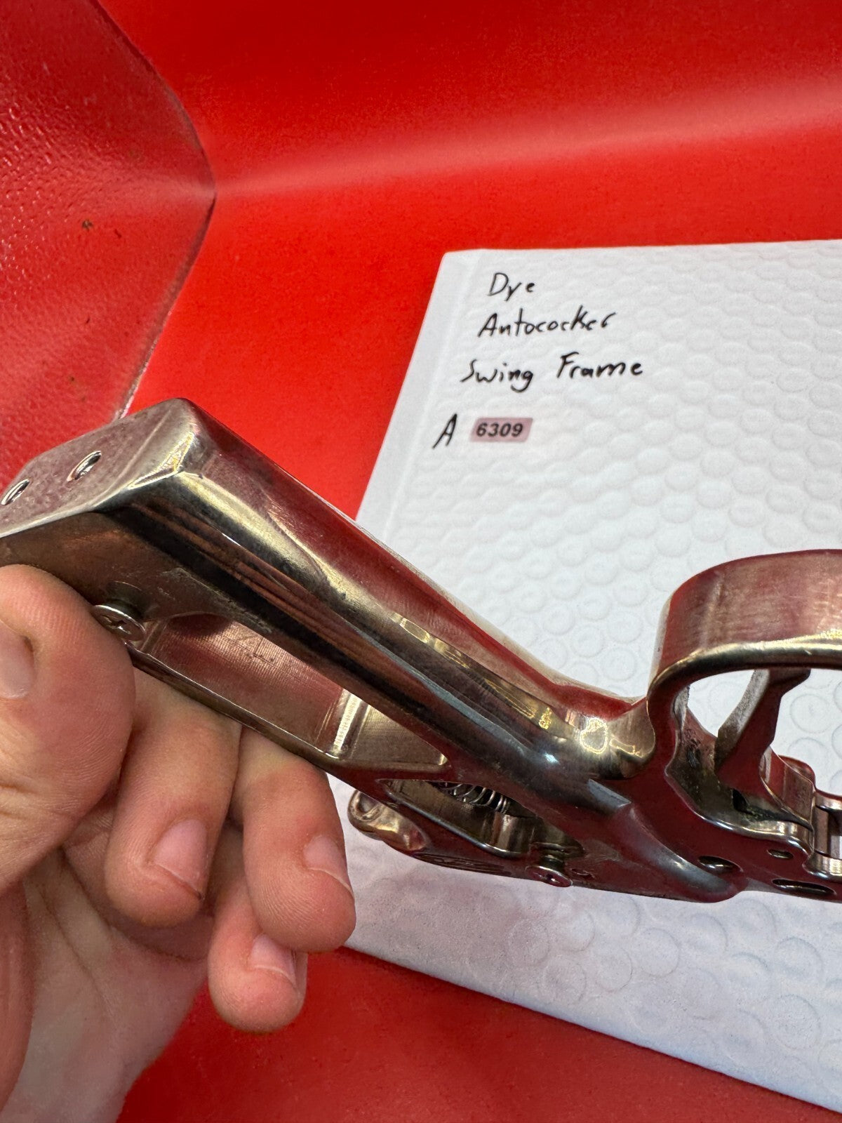 Dye Autococker Swing Frame