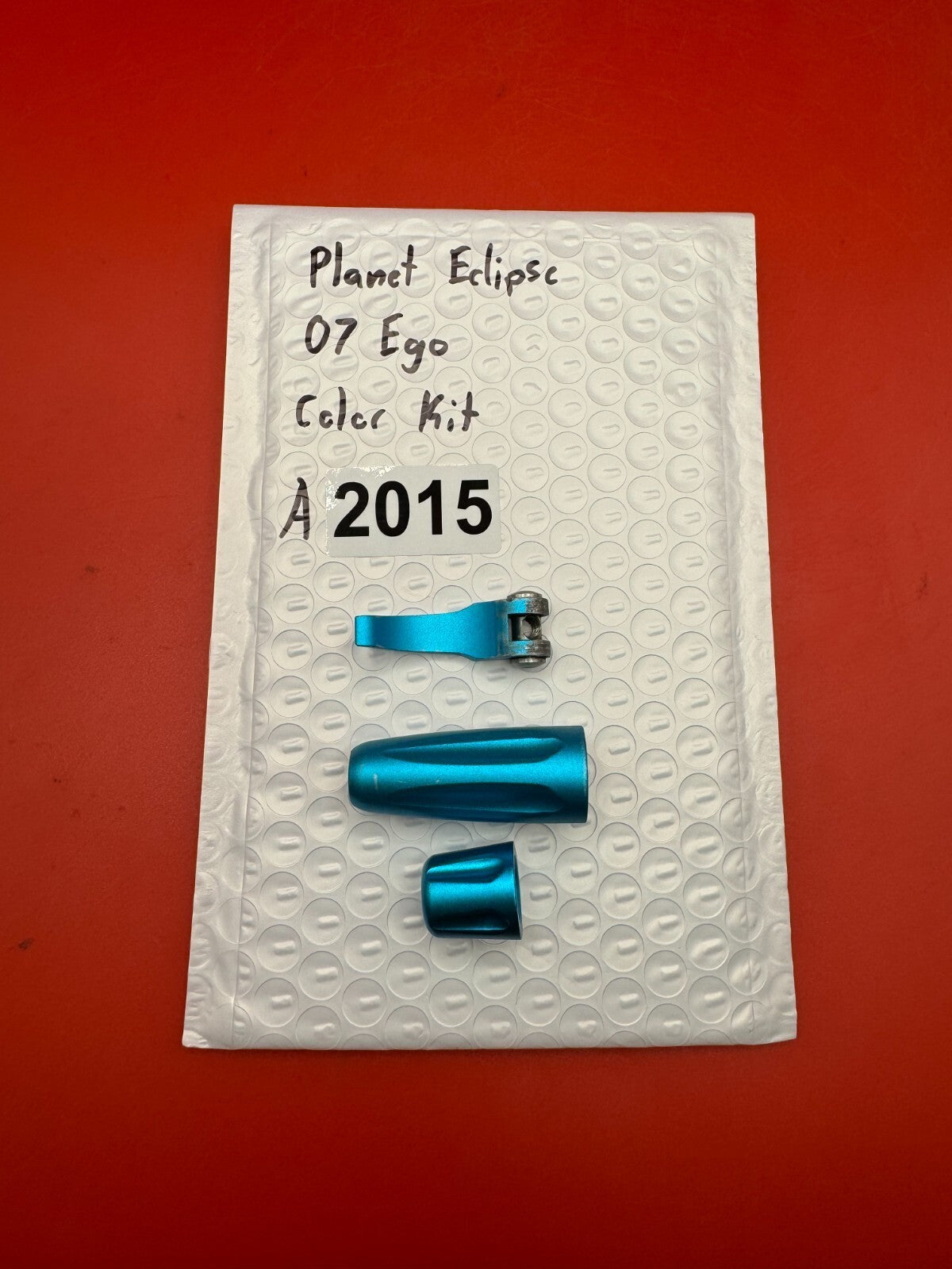 Planet Eclipse 07 Ego Color Kit - used paintball color kit (trigger, lpr cap, asa thumb screw) - teal anno