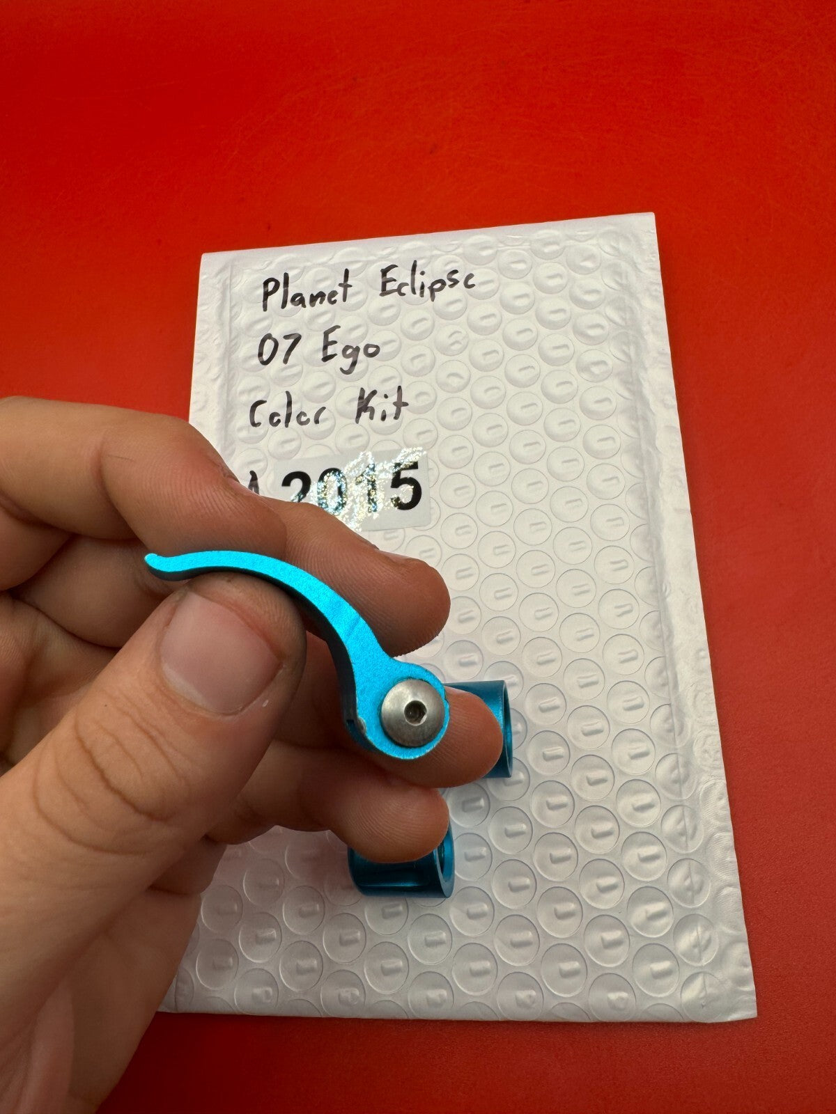 Planet Eclipse 07 Ego Color Kit - used paintball color kit (trigger, lpr cap, asa thumb screw) - teal anno
