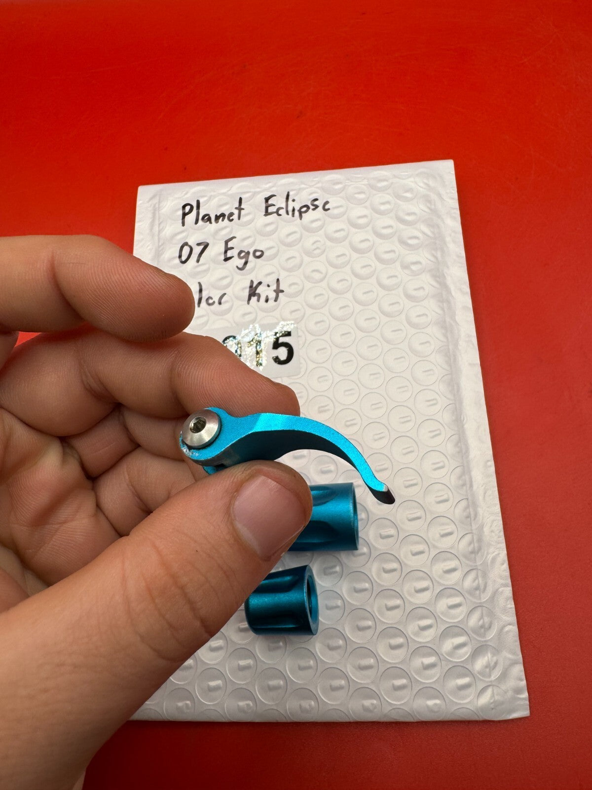 Planet Eclipse 07 Ego Color Kit - used paintball color kit (trigger, lpr cap, asa thumb screw) - teal anno