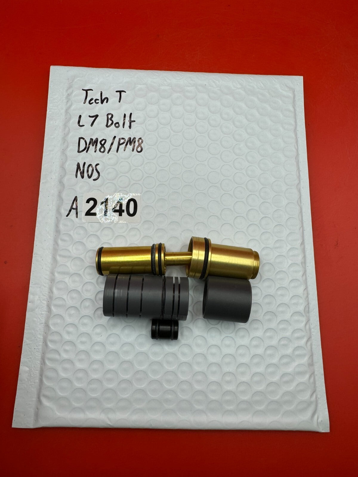 Tech T L7 Bolt DM8/PM8 NOS - used paintball bolt - gold/black