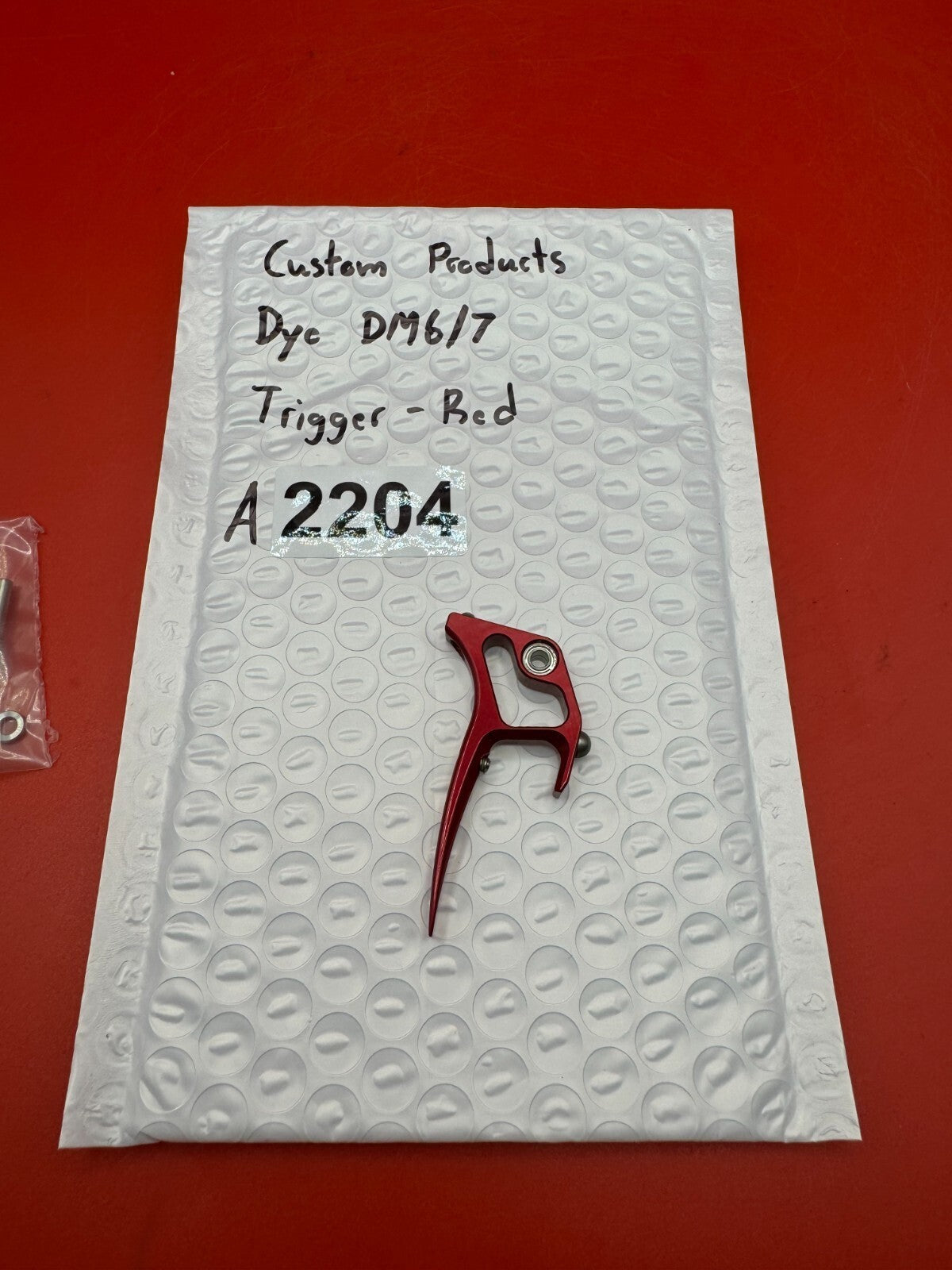 Custom Products Dye DM6/7 Trigger-Red - used paintball trigger - red anno