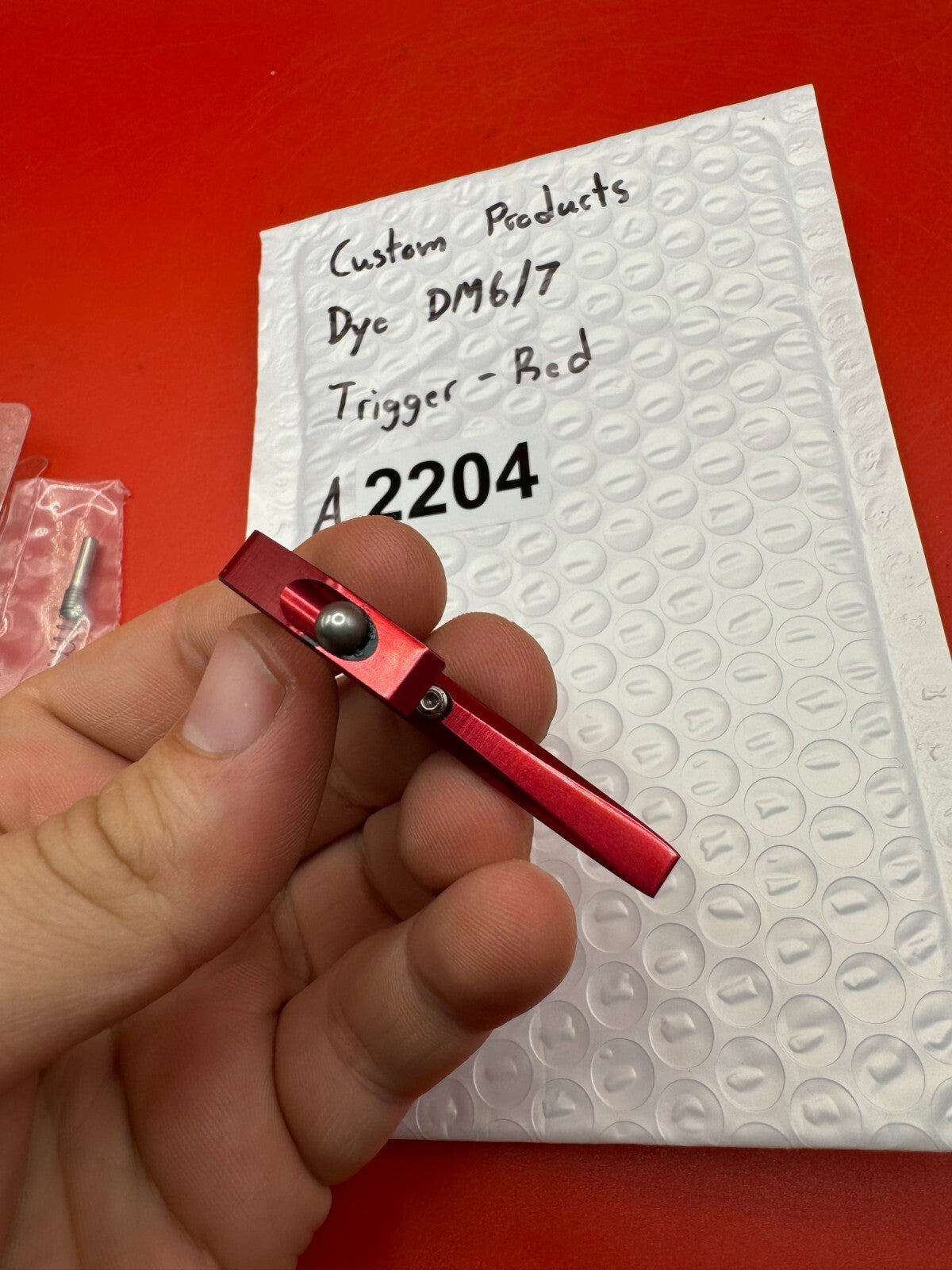 Custom Products Dye DM6/7 Trigger-Red - used paintball trigger - red anno