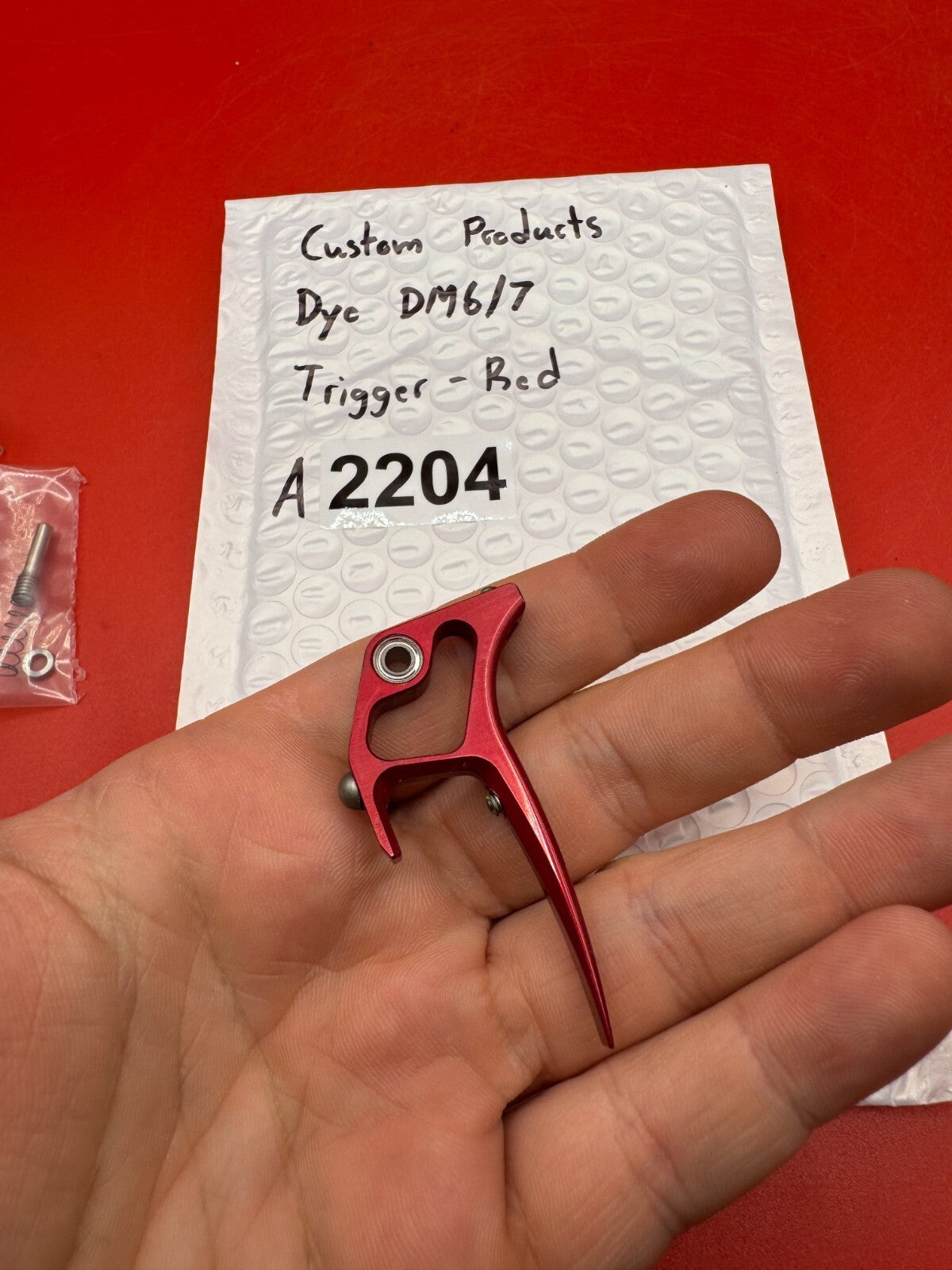 Custom Products Dye DM6/7 Trigger-Red - used paintball trigger - red anno