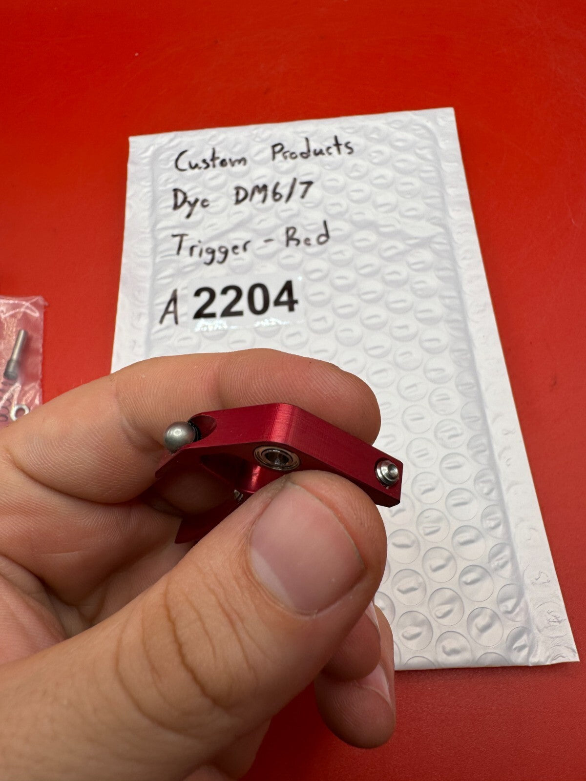 Custom Products Dye DM6/7 Trigger-Red - used paintball trigger - red anno