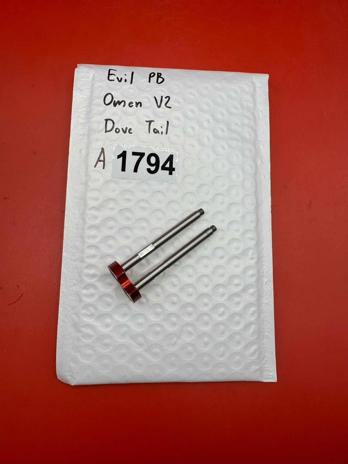 Evil PB Omen V2 Dove Tail - used paintball bolt dovetail / bolt tail assembly - red anno / silver