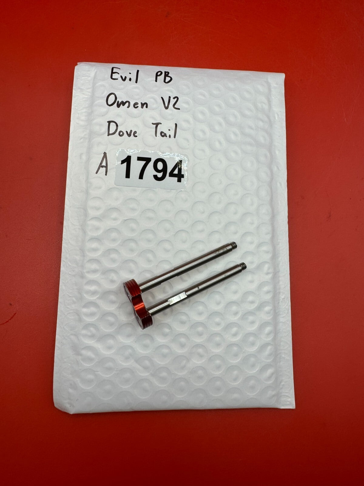 Evil PB Omen V2 Dove Tail - used paintball bolt dovetail / bolt tail assembly - red anno / silver