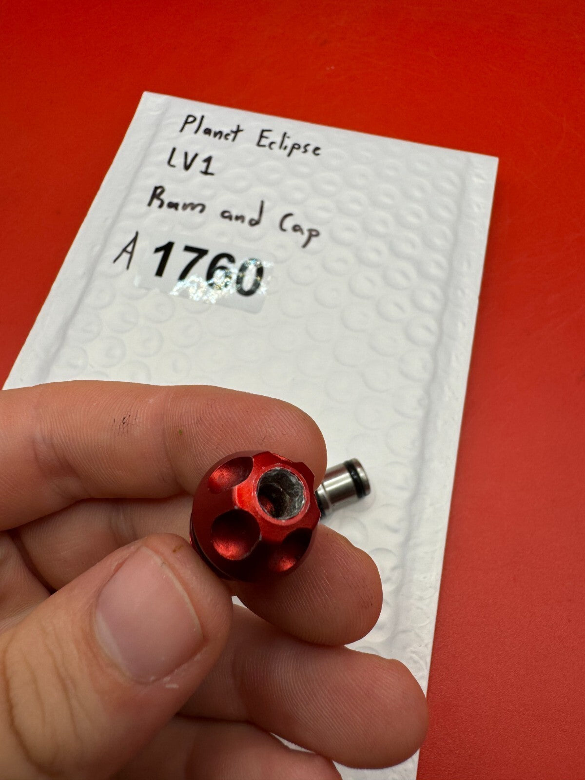 Planet Eclipse LV1 Ram and Cap - used paintball ram and cap assembly - red anno / stainless