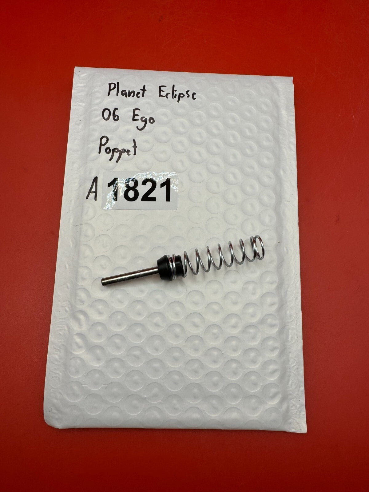 Planet Eclipse 06 Ego Poppet - used paintball poppet valve assembly - black/silver