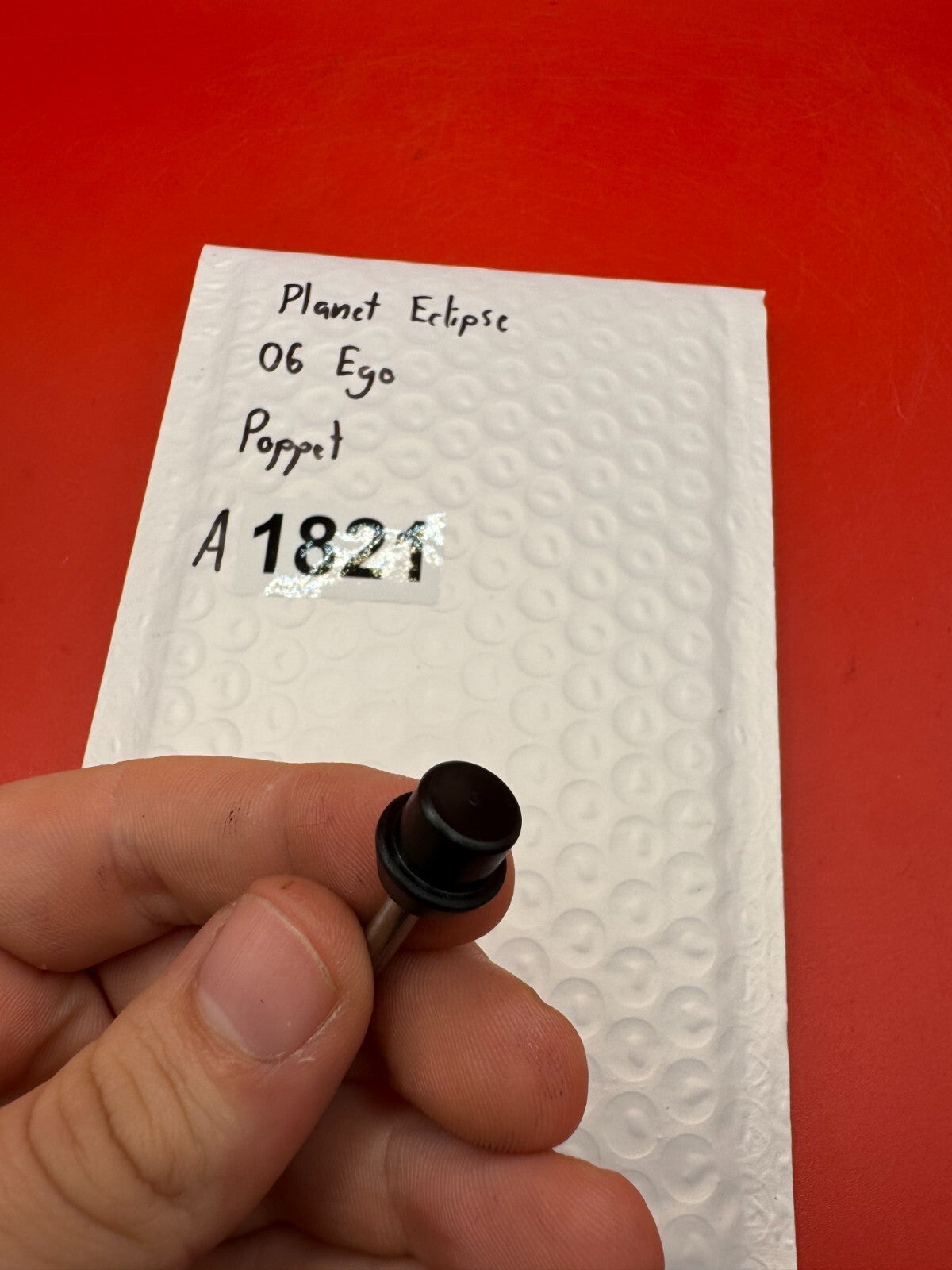 Planet Eclipse 06 Ego Poppet - used paintball poppet valve assembly - black/silver