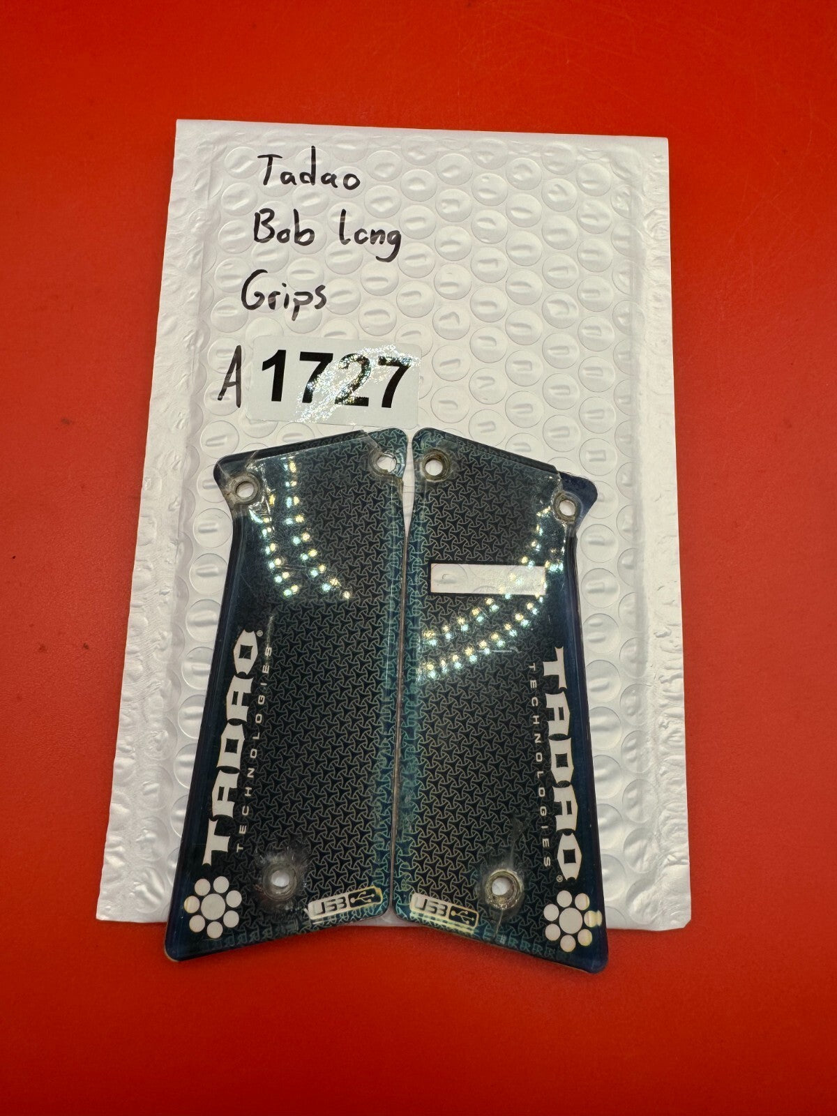 Tadao Bob Long Grips - used paintball grip panels - black/clear (front), white (back/substrate)
