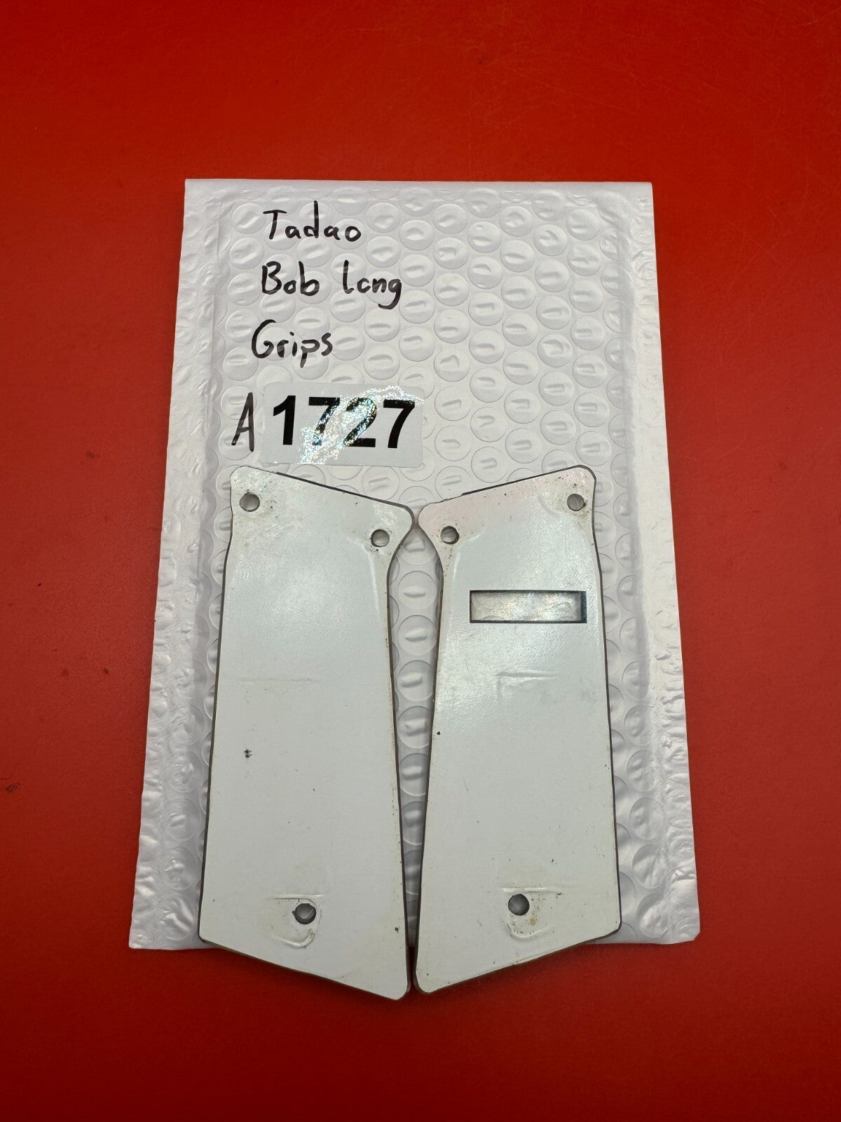 Tadao Bob Long Grips - used paintball grip panels - black/clear (front), white (back/substrate)
