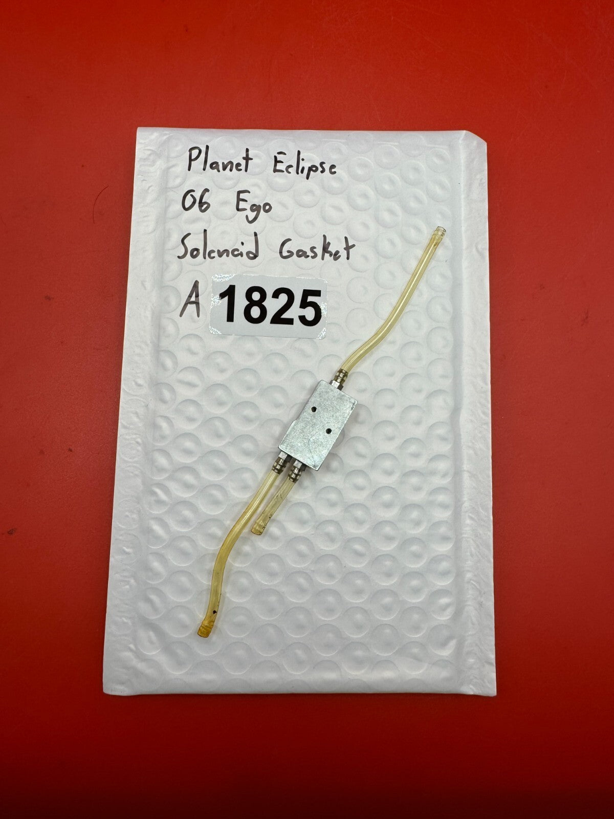 Planet Eclipse 06 Ego Solenoid Gasket - used paintball solenoid gasket assembly - silver