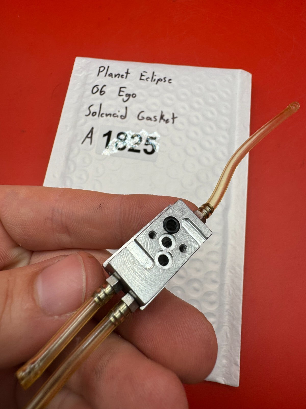 Planet Eclipse 06 Ego Solenoid Gasket - used paintball solenoid gasket assembly - silver