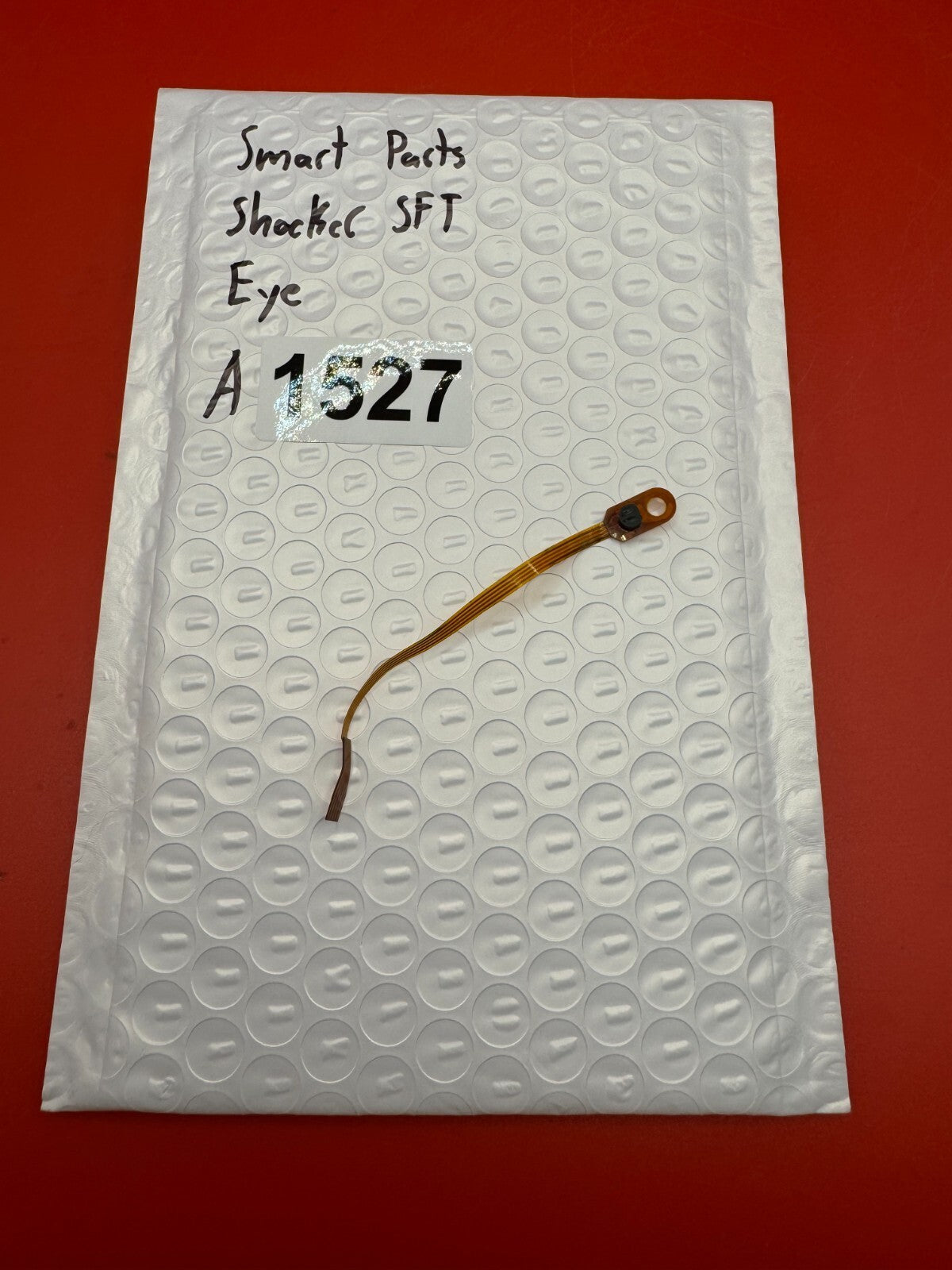 Smart Parts Shocker SFT Eye - used paintball eye (ball detent sensor) - amber/black