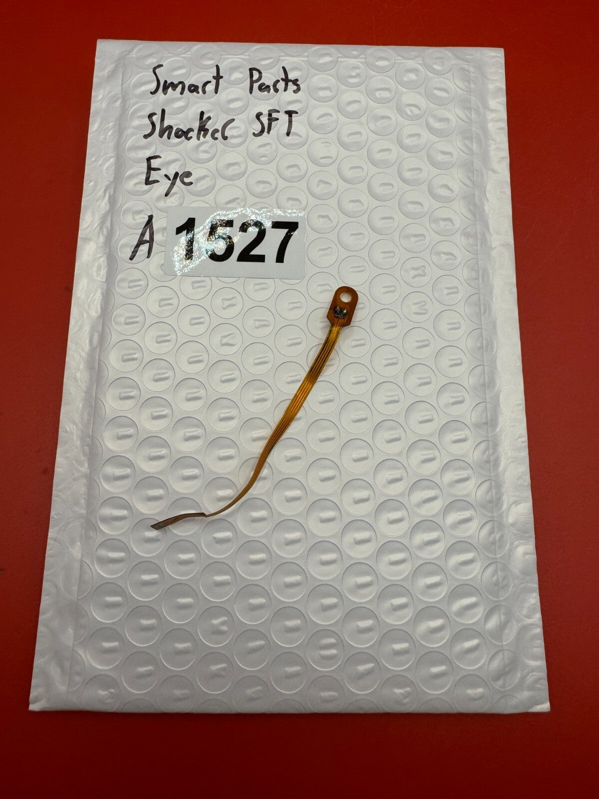 Smart Parts Shocker SFT Eye - used paintball eye (ball detent sensor) - amber/black