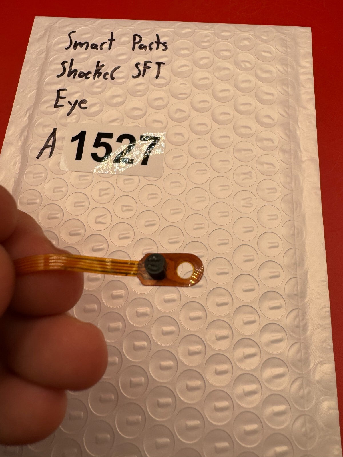 Smart Parts Shocker SFT Eye - used paintball eye (ball detent sensor) - amber/black