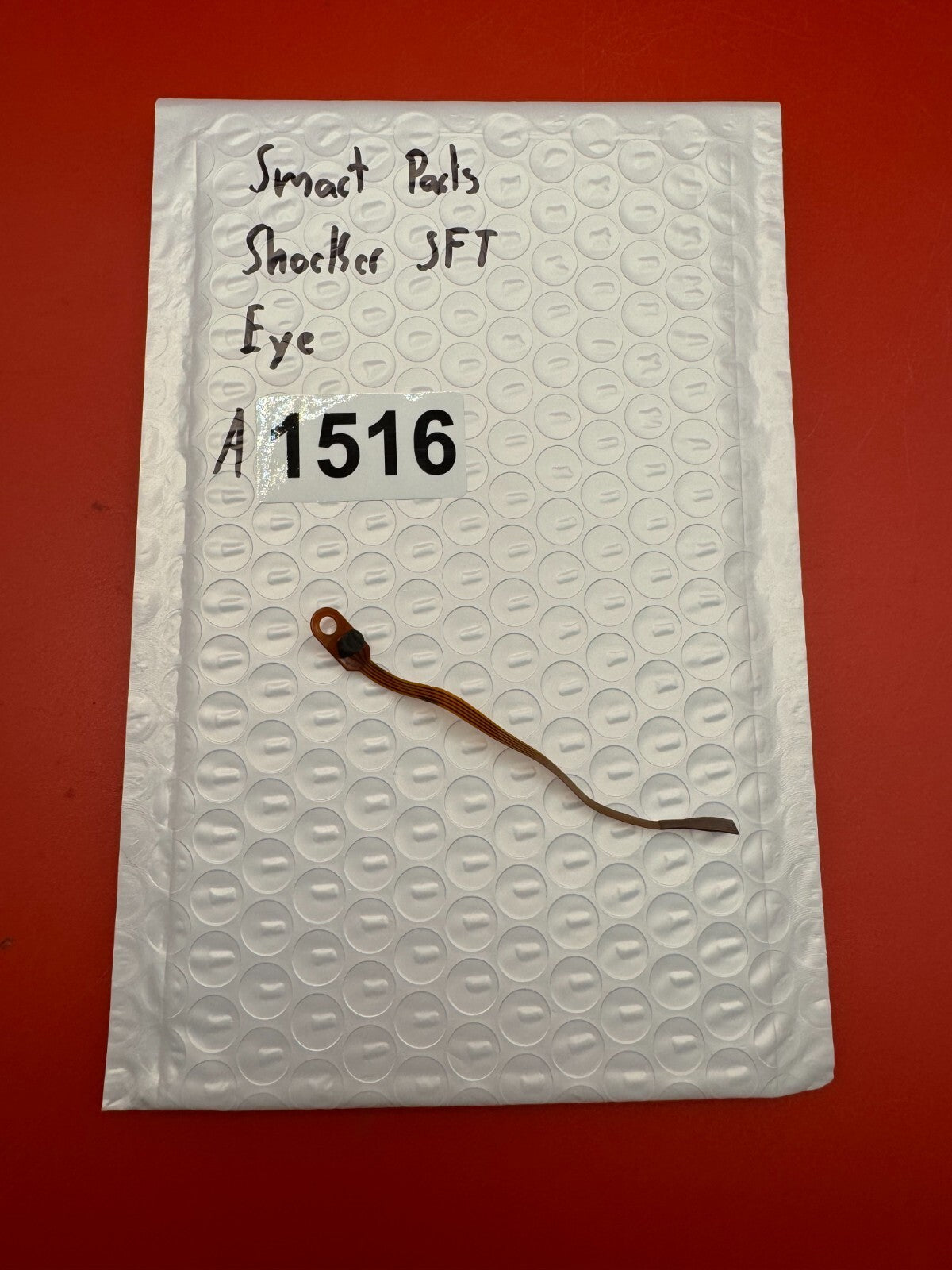Smart Parts Shocker SFT Eye - used paintball eye (ball detent sensor / flex cable assembly) - copper/amber