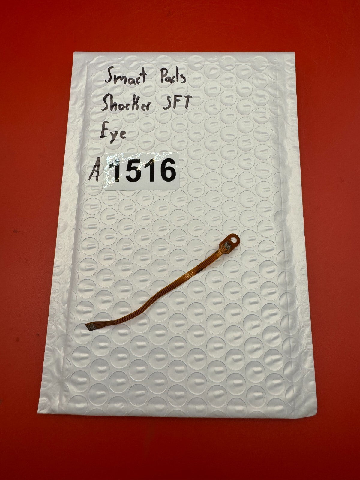 Smart Parts Shocker SFT Eye - used paintball eye (ball detent sensor / flex cable assembly) - copper/amber