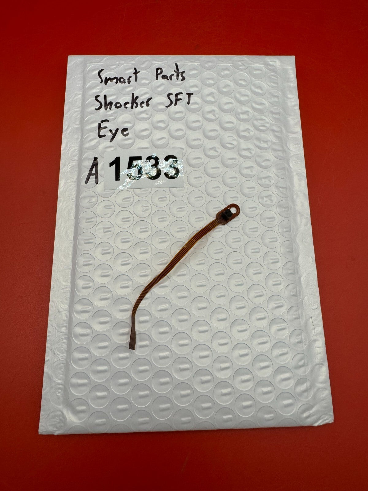Smart Parts Shocker SFT Eye - used paintball eye (anti-chop eye / optical sensor) - amber/brown