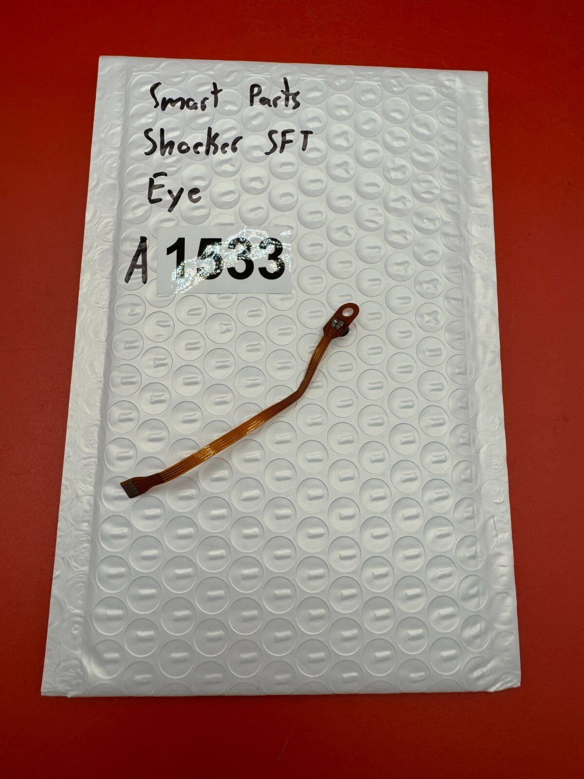 Smart Parts Shocker SFT Eye - used paintball eye (anti-chop eye / optical sensor) - amber/brown