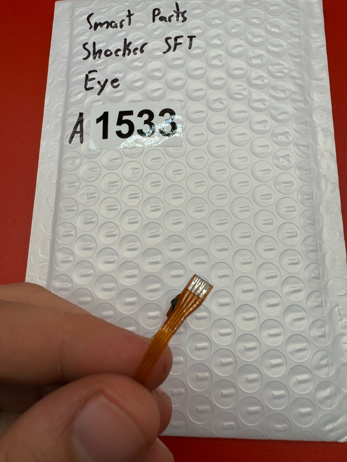 Smart Parts Shocker SFT Eye - used paintball eye (anti-chop eye / optical sensor) - amber/brown