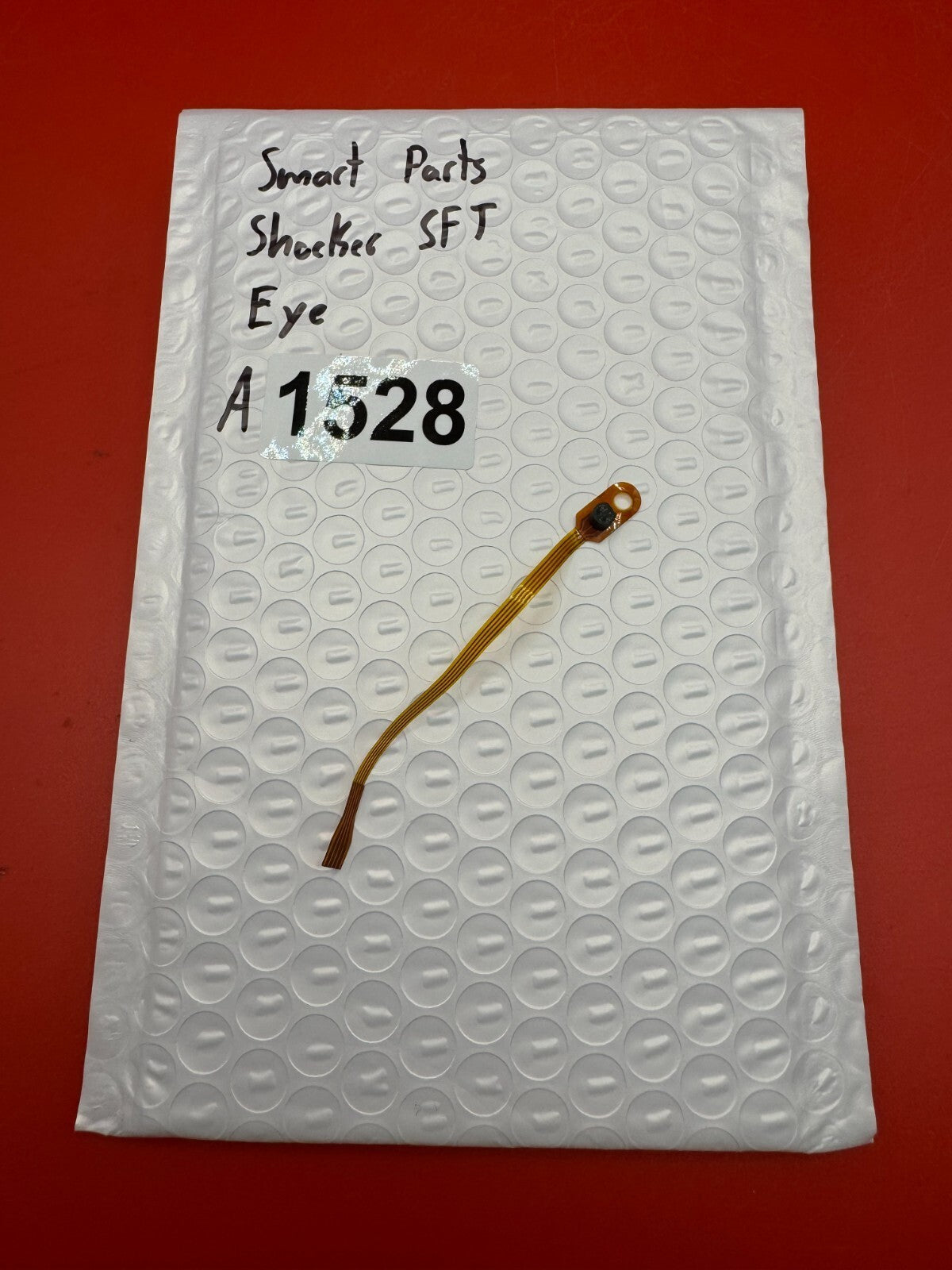 Smart Parts Shocker SFT Eye - used paintball eye (ball detent sensor) - amber/black