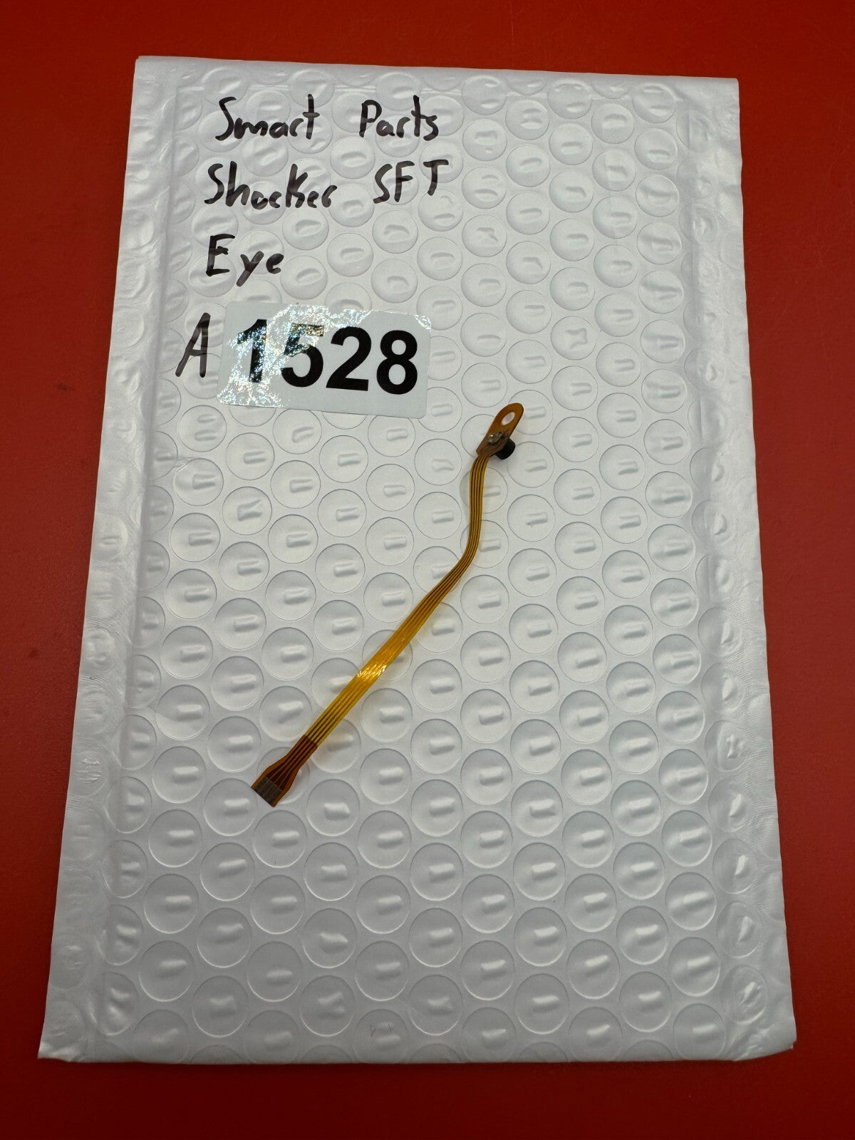 Smart Parts Shocker SFT Eye - used paintball eye (ball detent sensor) - amber/black
