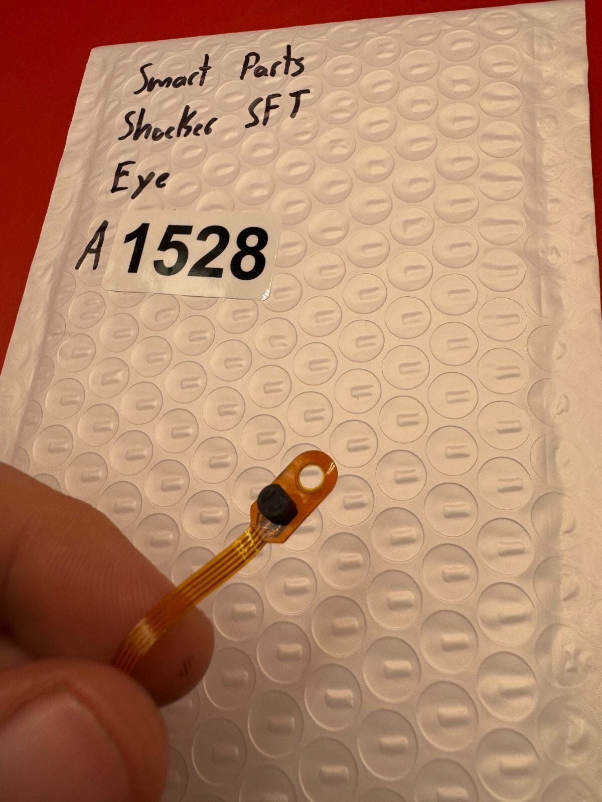 Smart Parts Shocker SFT Eye - used paintball eye (ball detent sensor) - amber/black