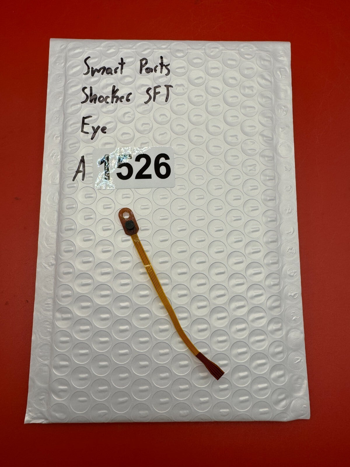 Smart Parts Shocker SFT Eye - used paintball eye (ball detent sensor) - amber/black