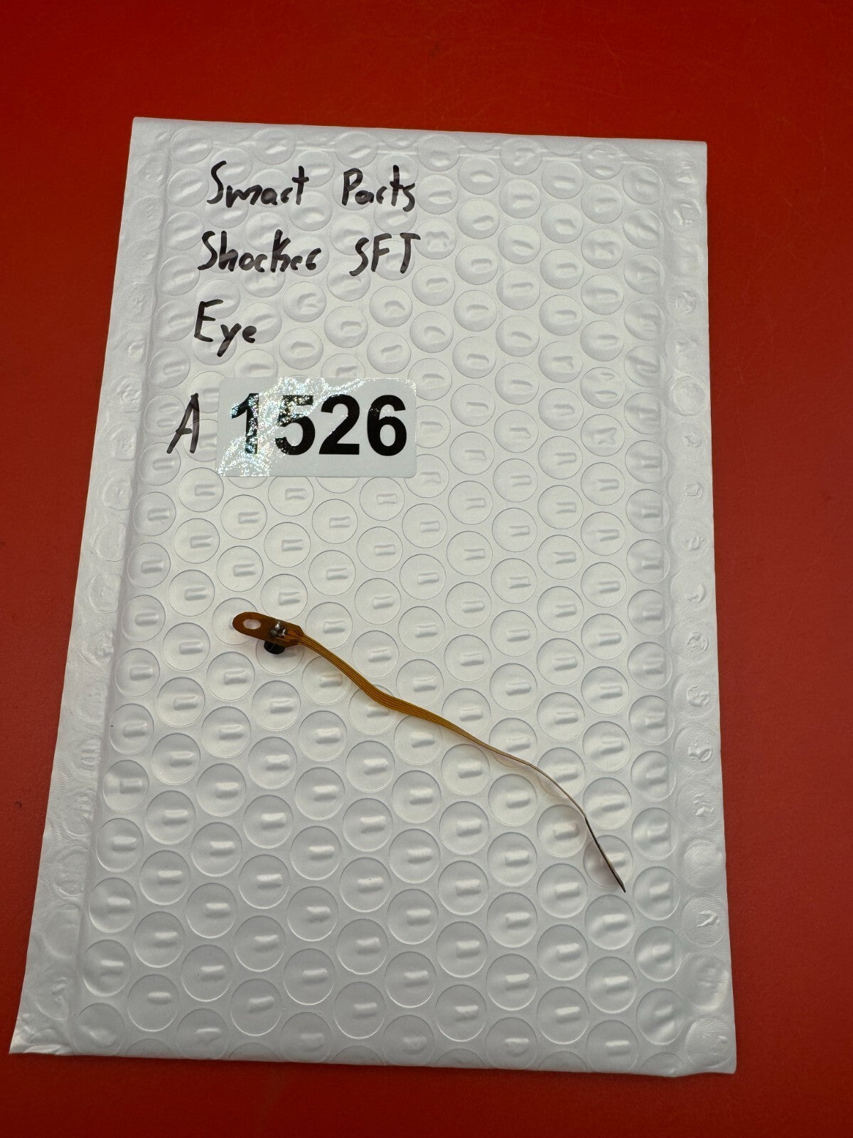 Smart Parts Shocker SFT Eye - used paintball eye (ball detent sensor) - amber/black