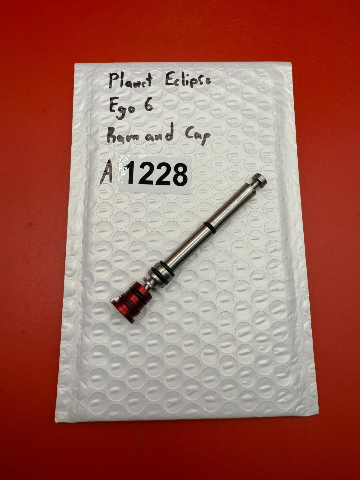 Planet Eclipse Ego 6 Ram and Cap - used paintball ram and ram cap - red anno / stainless