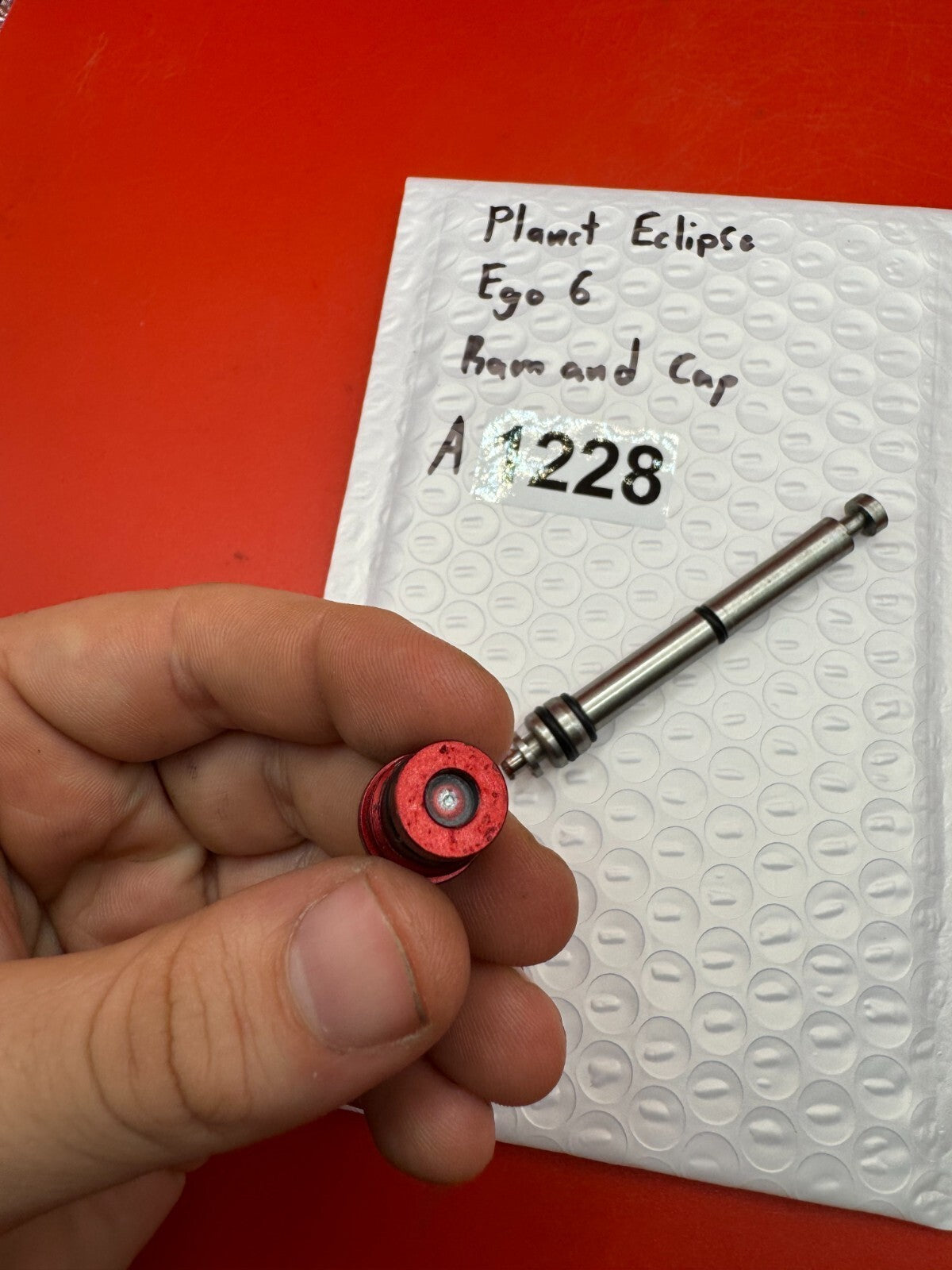 Planet Eclipse Ego 6 Ram and Cap - used paintball ram and ram cap - red anno / stainless