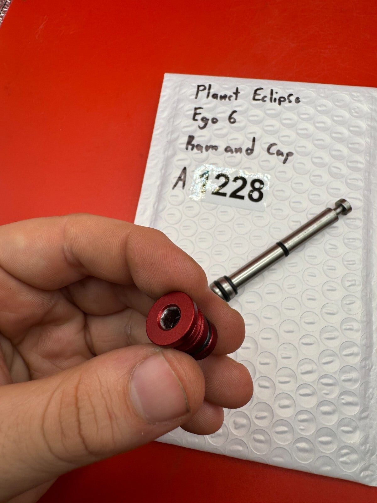 Planet Eclipse Ego 6 Ram and Cap - used paintball ram and ram cap - red anno / stainless
