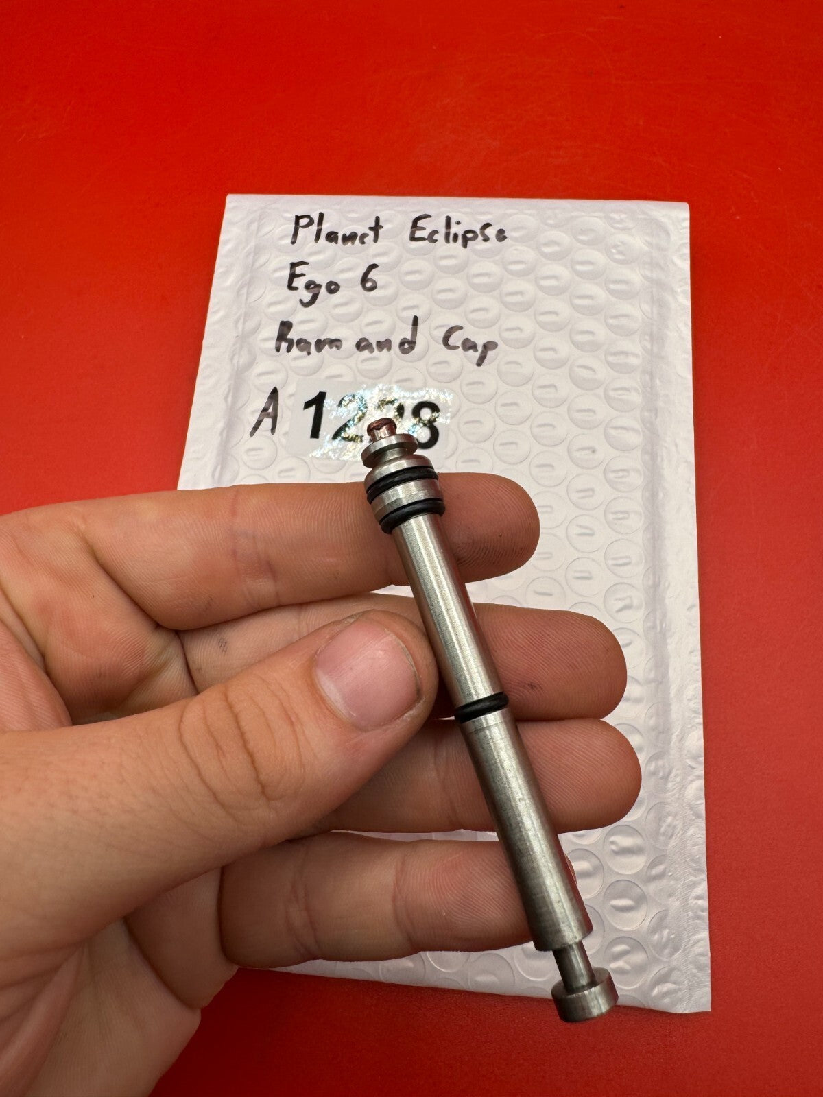 Planet Eclipse Ego 6 Ram and Cap - used paintball ram and ram cap - red anno / stainless