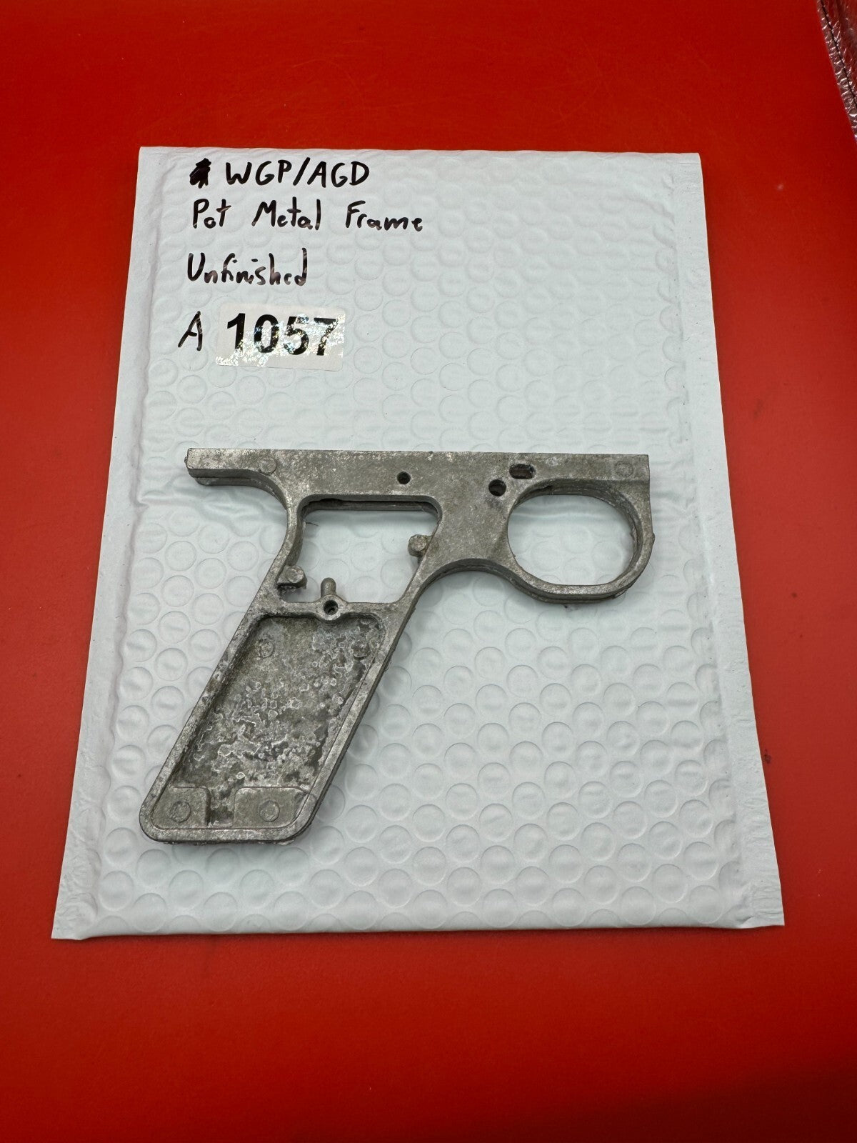 WGP/AGD Pot Metal Frame Unfinished - used paintball grip frame - raw pot metal / unfinished silver-grey