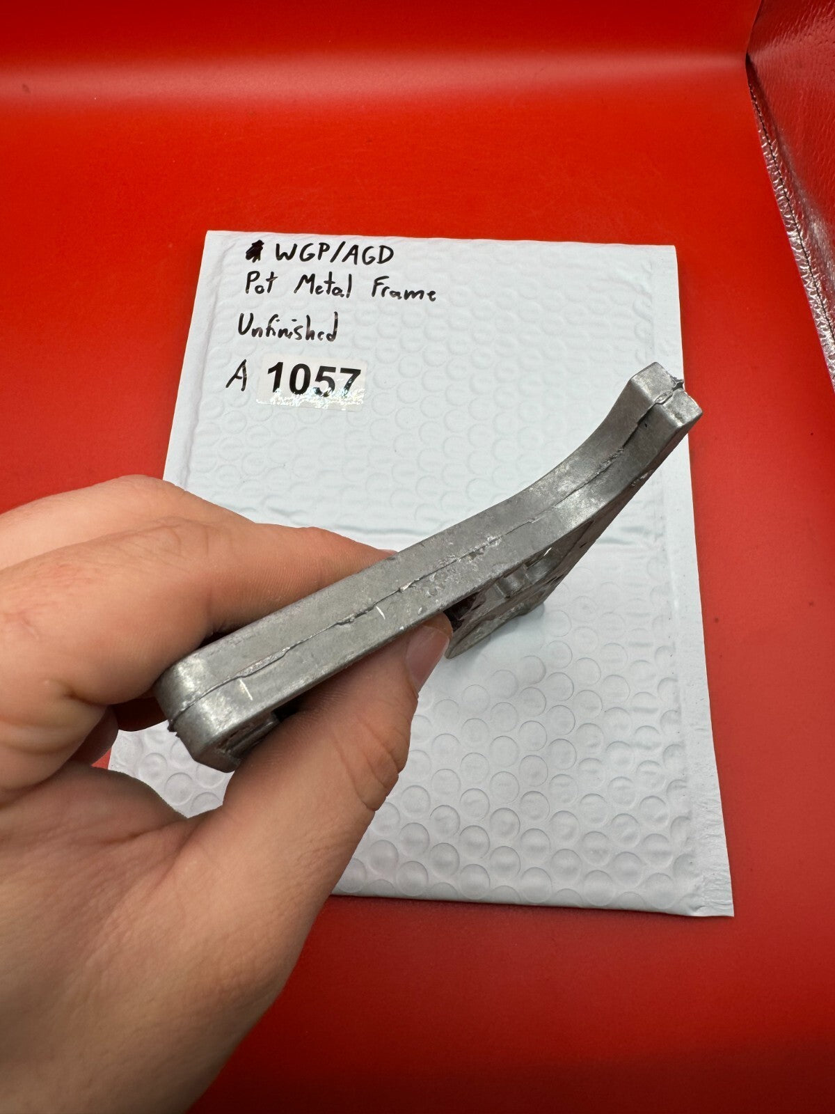 WGP/AGD Pot Metal Frame Unfinished - used paintball grip frame - raw pot metal / unfinished silver-grey