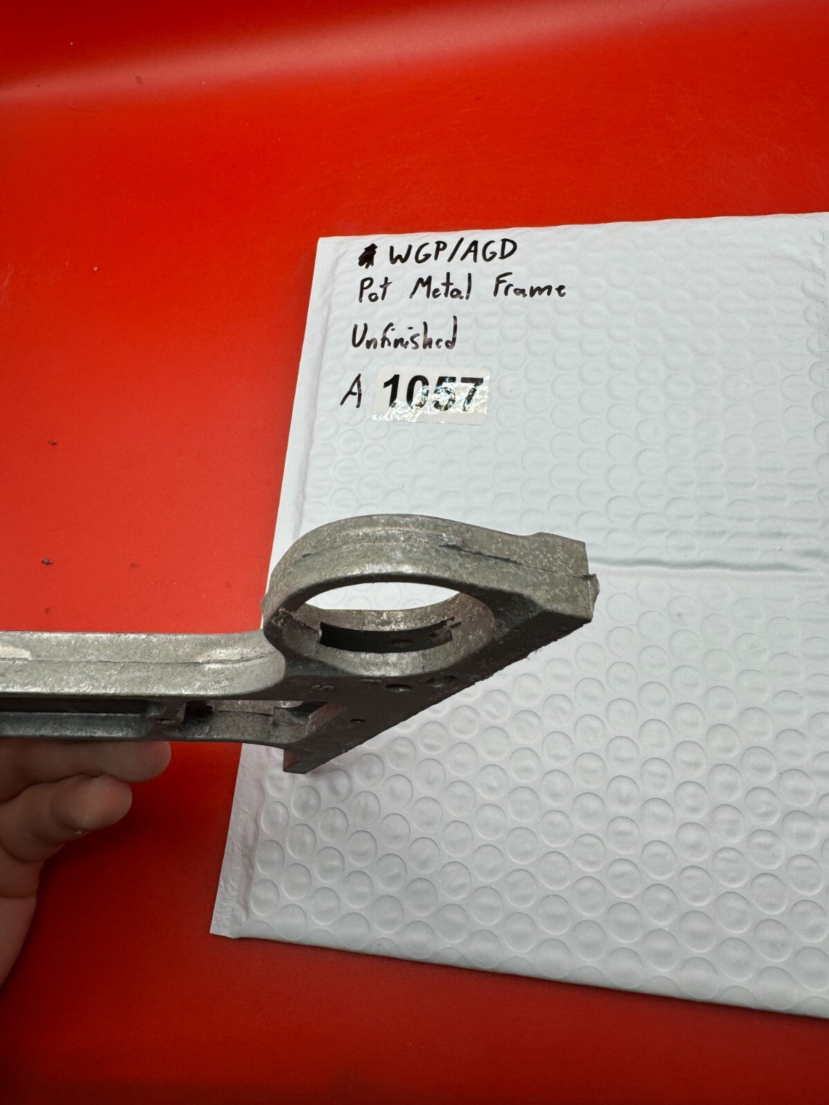 WGP/AGD Pot Metal Frame Unfinished - used paintball grip frame - raw pot metal / unfinished silver-grey