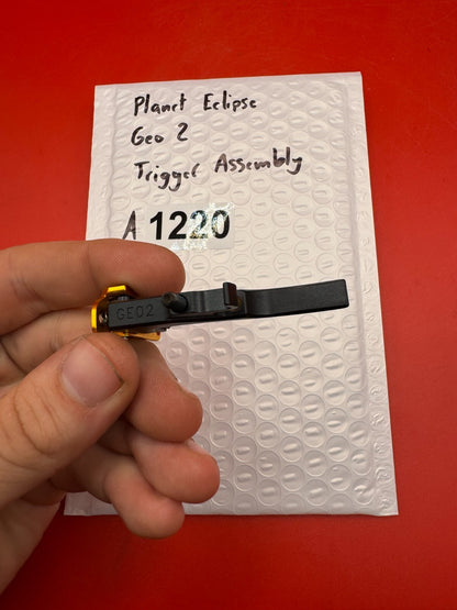 Planet Eclipse Geo 2 Trigger Assembly - used paintball trigger assembly - black/gold