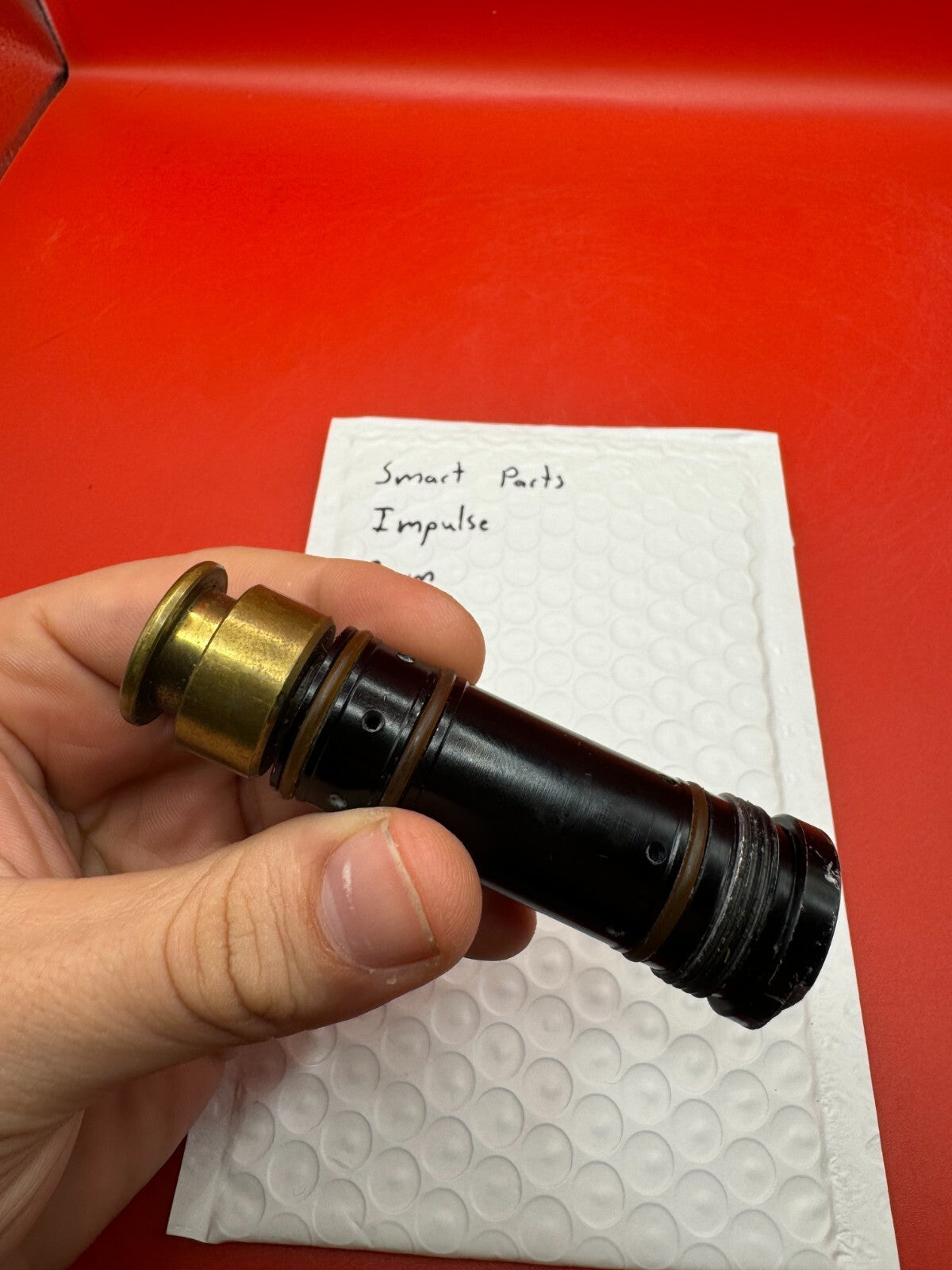 Smart Parts Impulse RAM - used paintball ram (pneumatic ram/piston) - black/brass