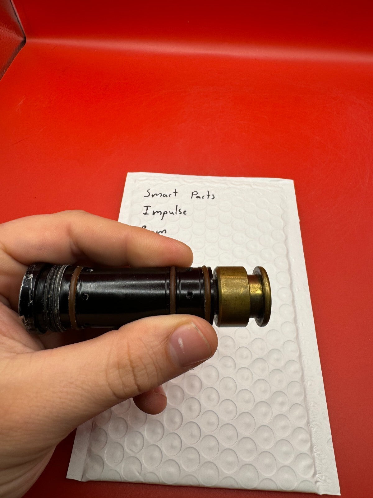Smart Parts Impulse RAM - used paintball ram (pneumatic ram/piston) - black/brass