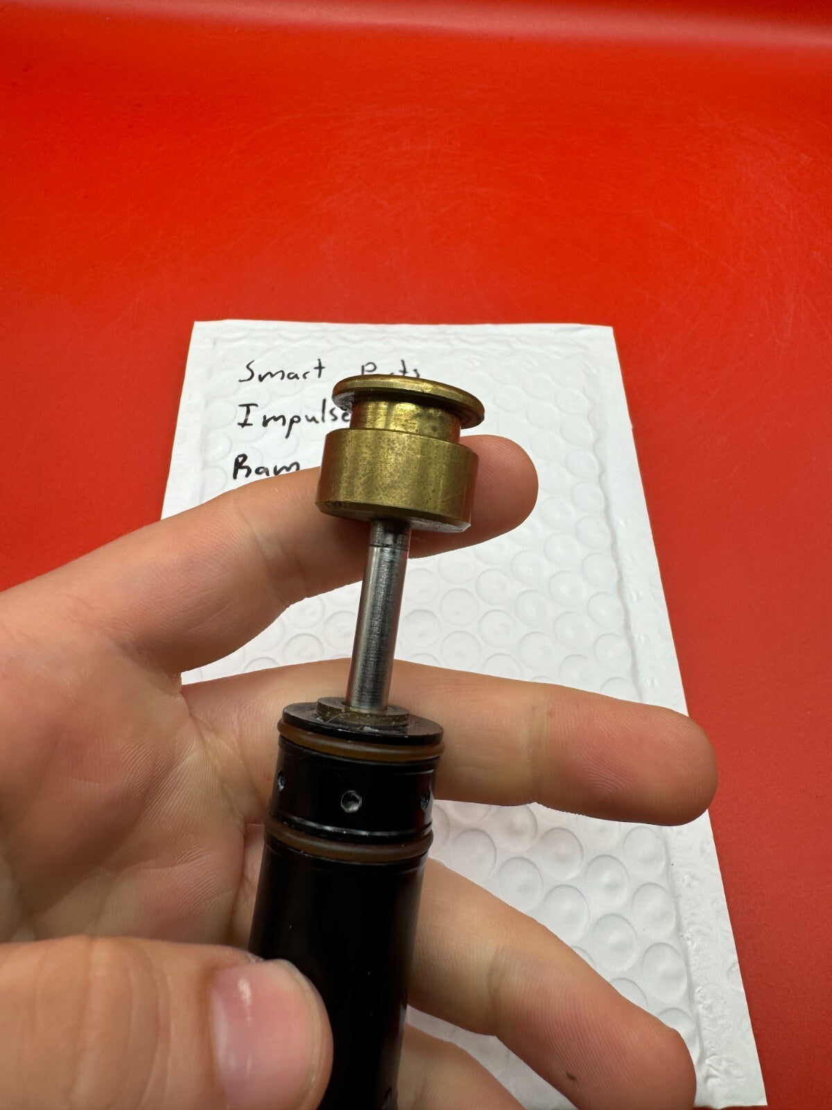 Smart Parts Impulse RAM - used paintball ram (pneumatic ram/piston) - black/brass