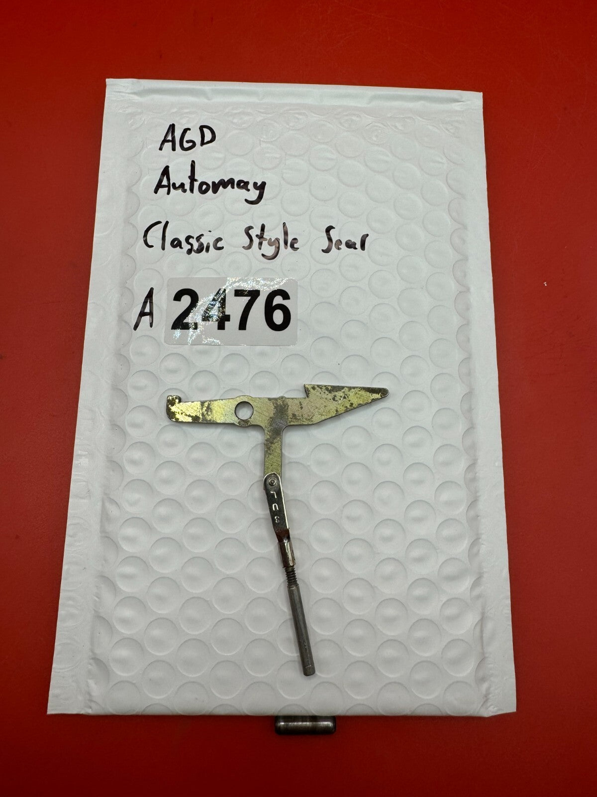 AGD Automag Classic Style Sear - used paintball sear - gold/zinc plated