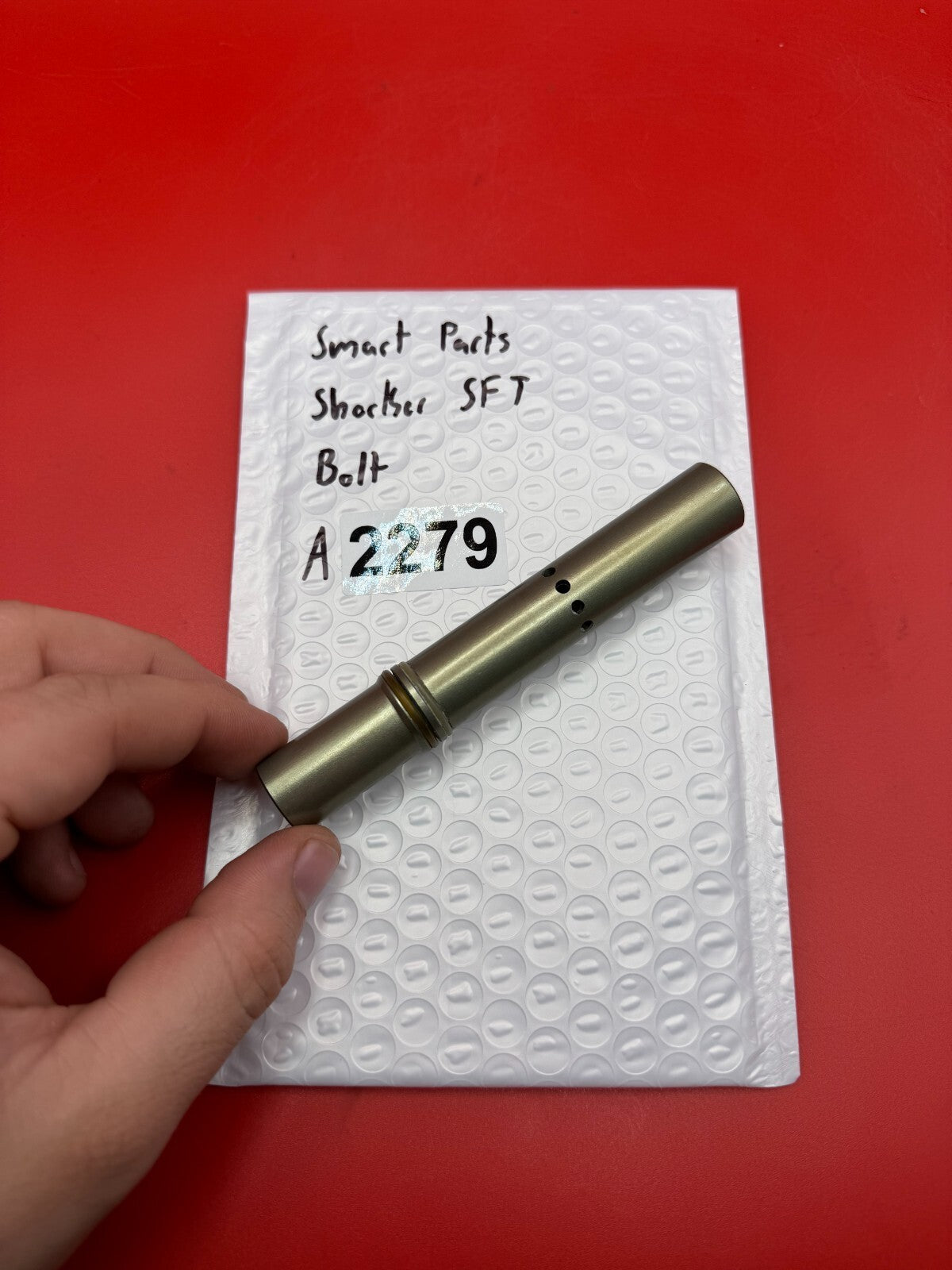 Smart Parts Shocker SFT Bolt - used paintball bolt - titanium/bronze
